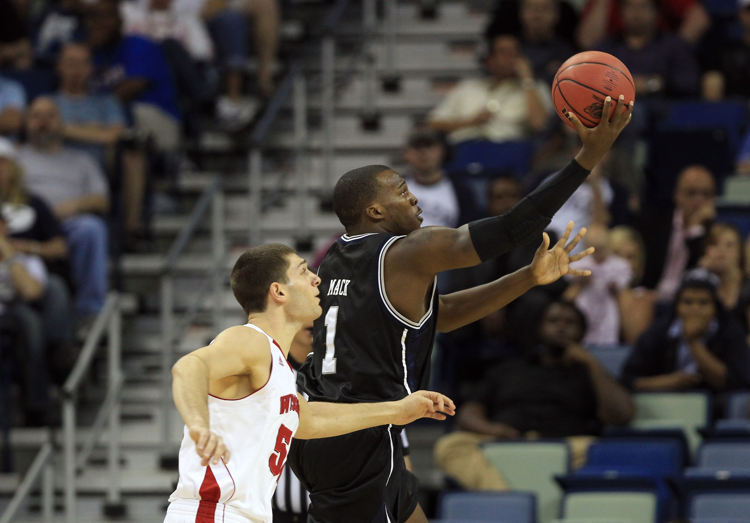 NEW ORLEANS, LA - MARCH 24:  Shelvin Mack #1 of the Butler Bulldogs shoots against Keaton Nankivil #52 of the Wisconsin Badgers during the Southeast regional of the 2011 NCAA men's basketball tournament at New Orleans Arena on March 24, 2011 in New Orlean