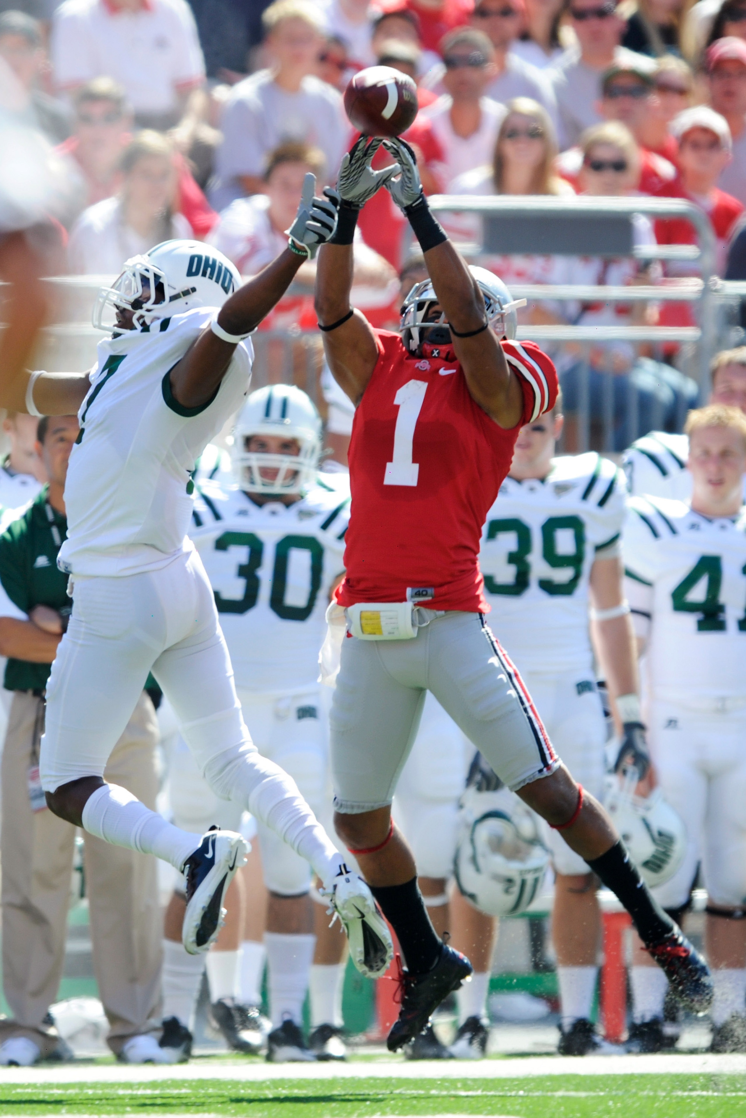 COLUMBUS, OH - SEPTEMBER 18:  Devon Torrence #1 of the Ohio State Buckeyes tips a pass away from LaVon Brazill #7 of the Ohio Bobcats at Ohio Stadium on September 18, 2010 in Columbus, Ohio. The pass was intercepted by Tyler Moeller #26 of the Ohio State