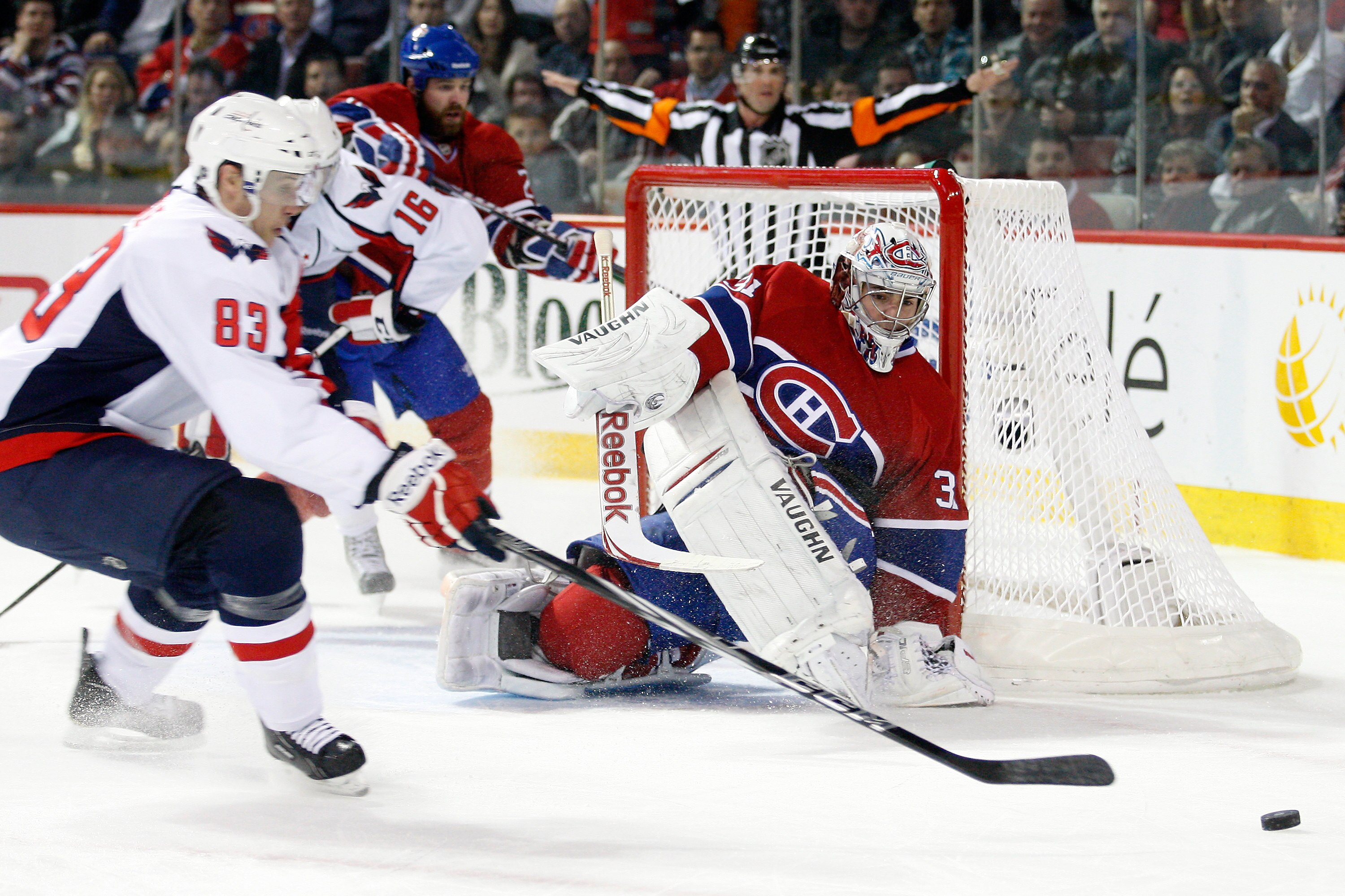 MONTREAL, CANADA - MARCH 15:  Goalie Carey Price #31 of the Montreal Canadiens watches a puck rebound  in front of Jay Beagle #83 of the Washington Capitals during the NHL game at the Bell Centre on March 15, 2011 in Montreal, Quebec, Canada.  The Capital