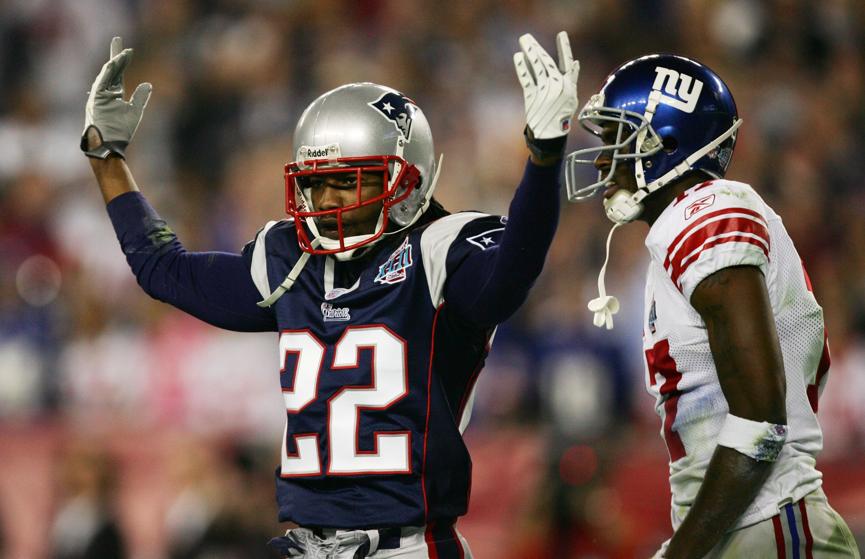 GLENDALE, AZ - FEBRUARY 03:  Cornerback Asante Samuel #22 of the New England Patriots celebrates after breaking-up a pass thrown to wide receiver Plaxico Burress #17 of the New York Giants in the third quarter during Super Bowl XLII on February 3, 2008 at