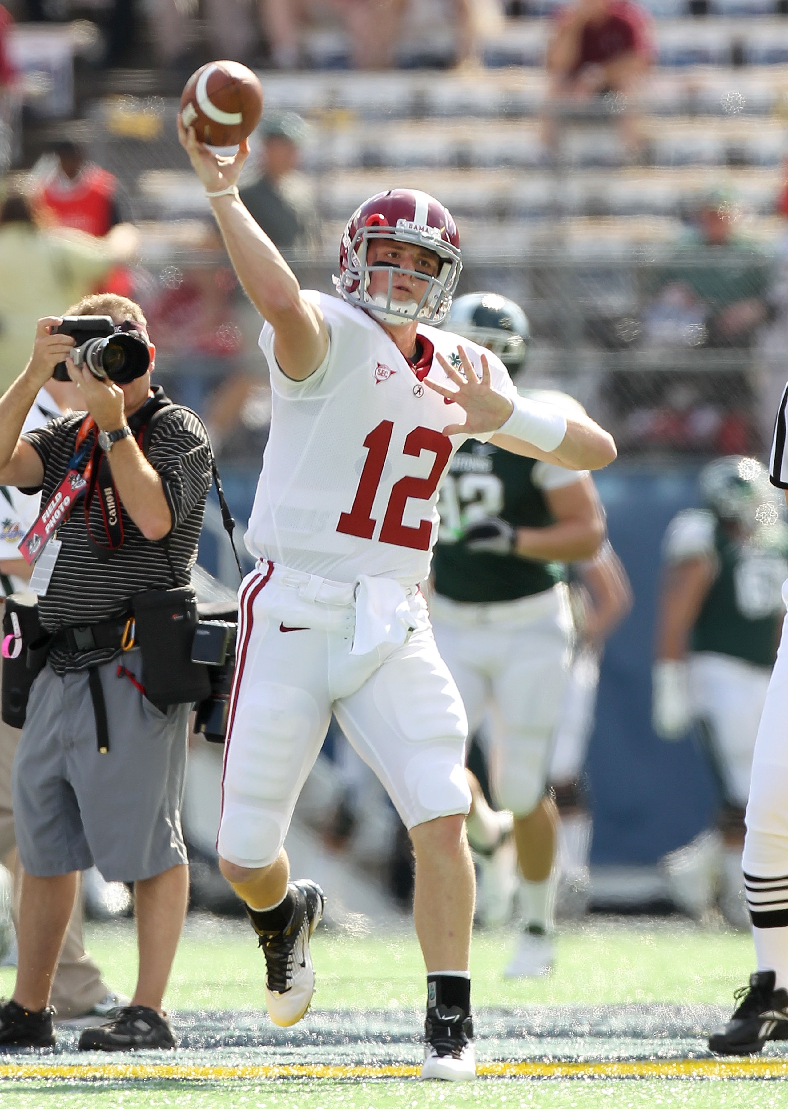 ORLANDO, FL - JANUARY 01: Greg McElroy #12 of the Alabama Crimson Tide warms up during the Capitol One Bowl against the Michigan State Spartans at the Florida Citrus Bowl on January 1, 2011 in Orlando, Florida.  (Photo by Mike Ehrmann/Getty Images)