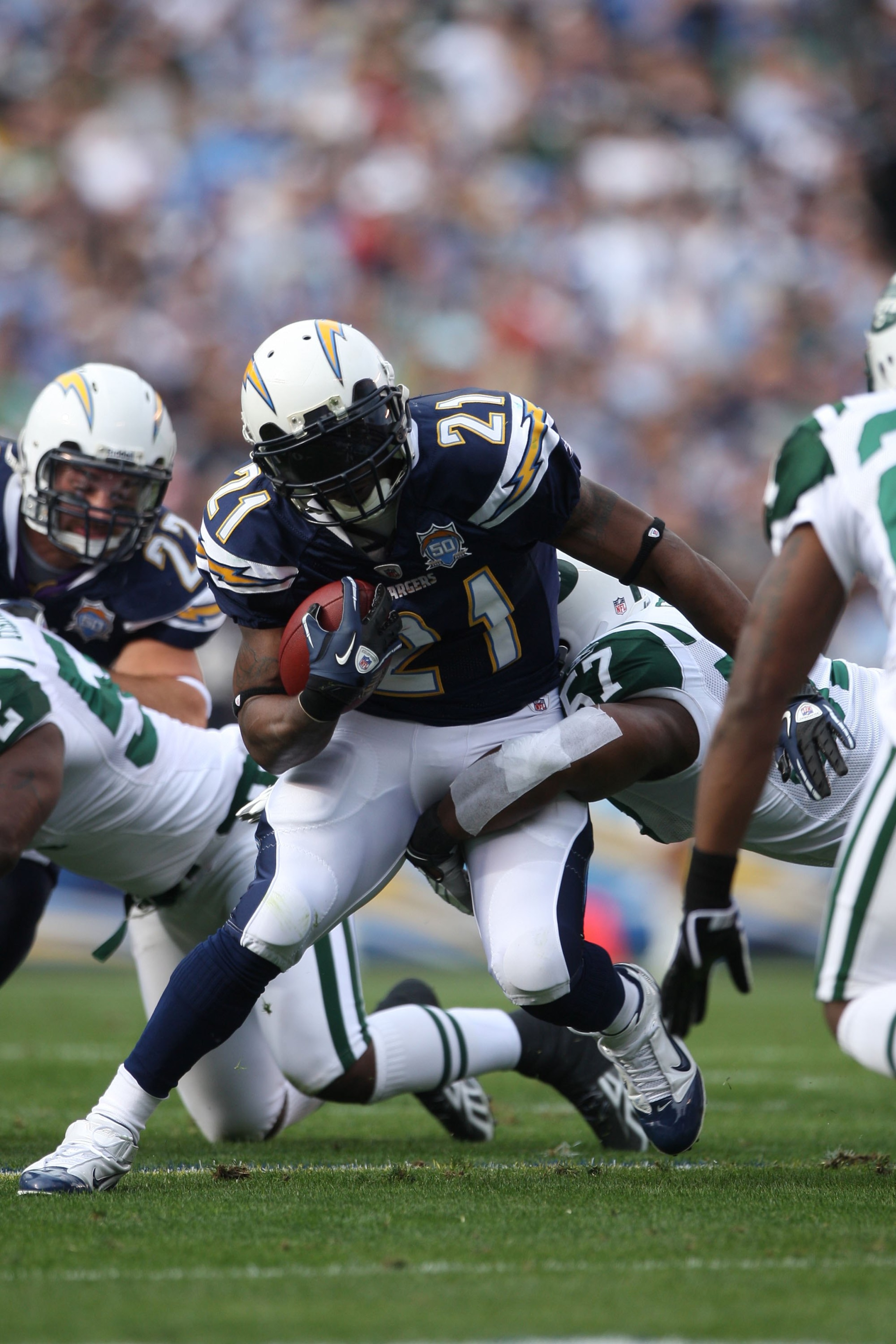 SAN DIEGO - JANUARY 17:  Running back LaDainian Tomlinson #21 of the San Diego Chargers runs with the ball against the New York Jets during the AFC Divisional Playoff Game at Qualcomm Stadium on January 17, 2010 in San Diego, California.  (Photo by Donald