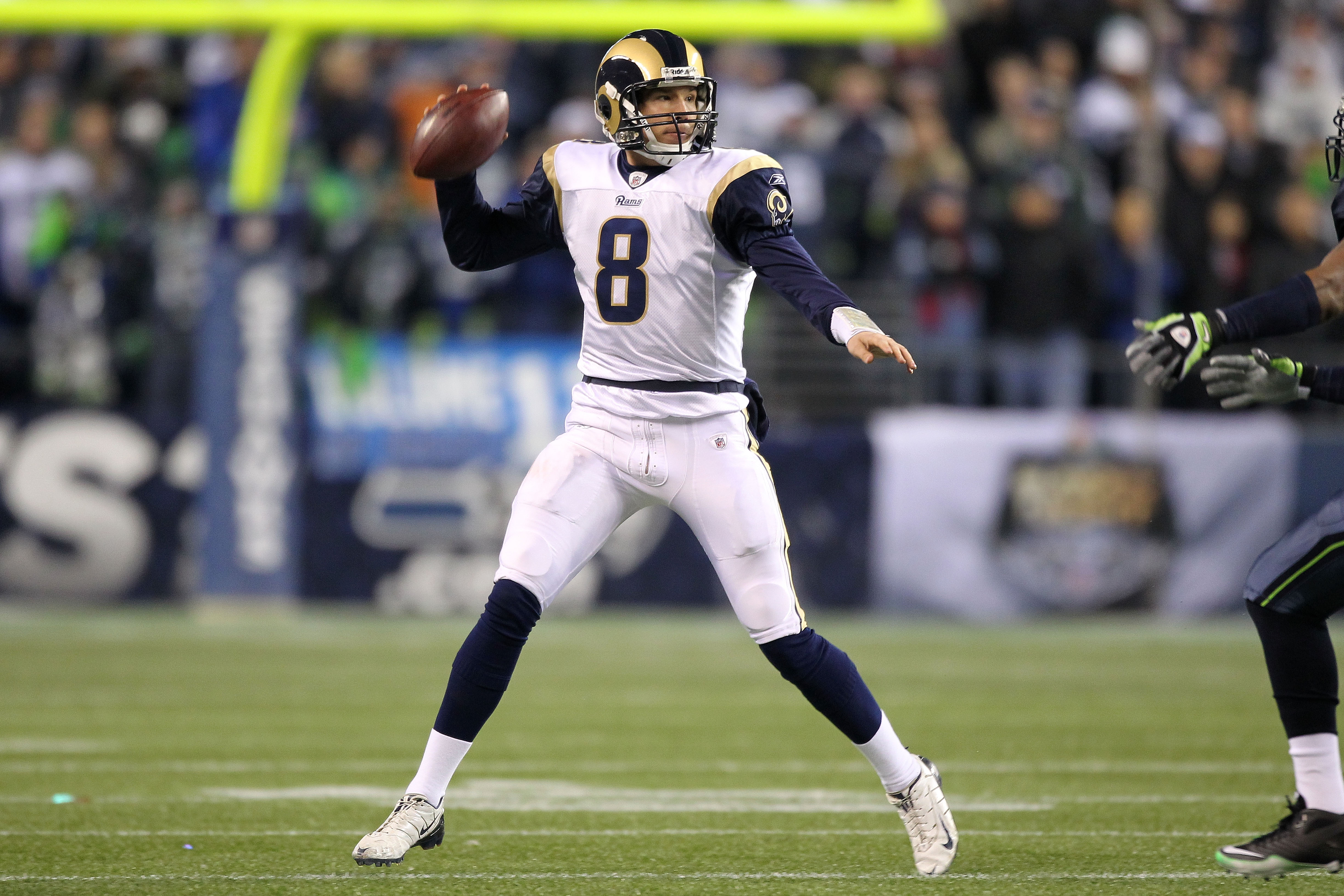 SEATTLE, WA - JANUARY 02:  Quarterback Sam Bradford #8 of the St. Louis Rams looks to pass against the Seattle Seahawks during their game at Qwest Field on January 2, 2011 in Seattle, Washington.  (Photo by Otto Greule Jr/Getty Images)