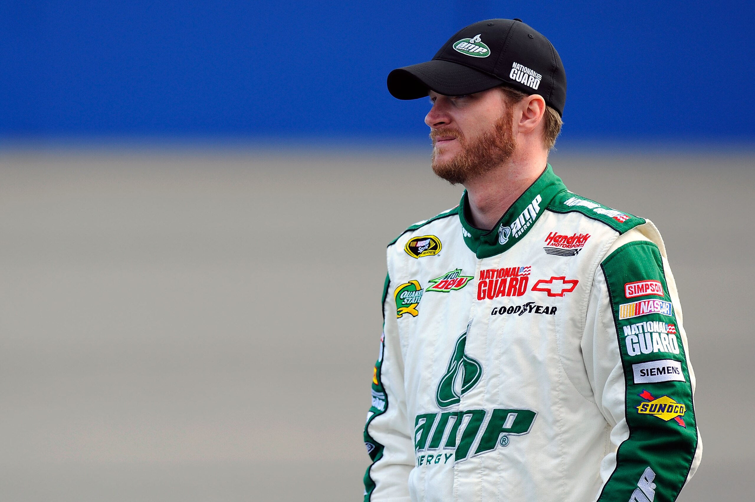 FONTANA, CA - MARCH 25:  Dale Earnhardt Jr., driver of the #88 AMP Energy/National Guard Chevrolet, stands on pit road during qualifying for the NASCAR Sprint Cup Series Auto Club 400 at Auto Club Speedway on March 25, 2011 in Fontana, California.  (Photo
