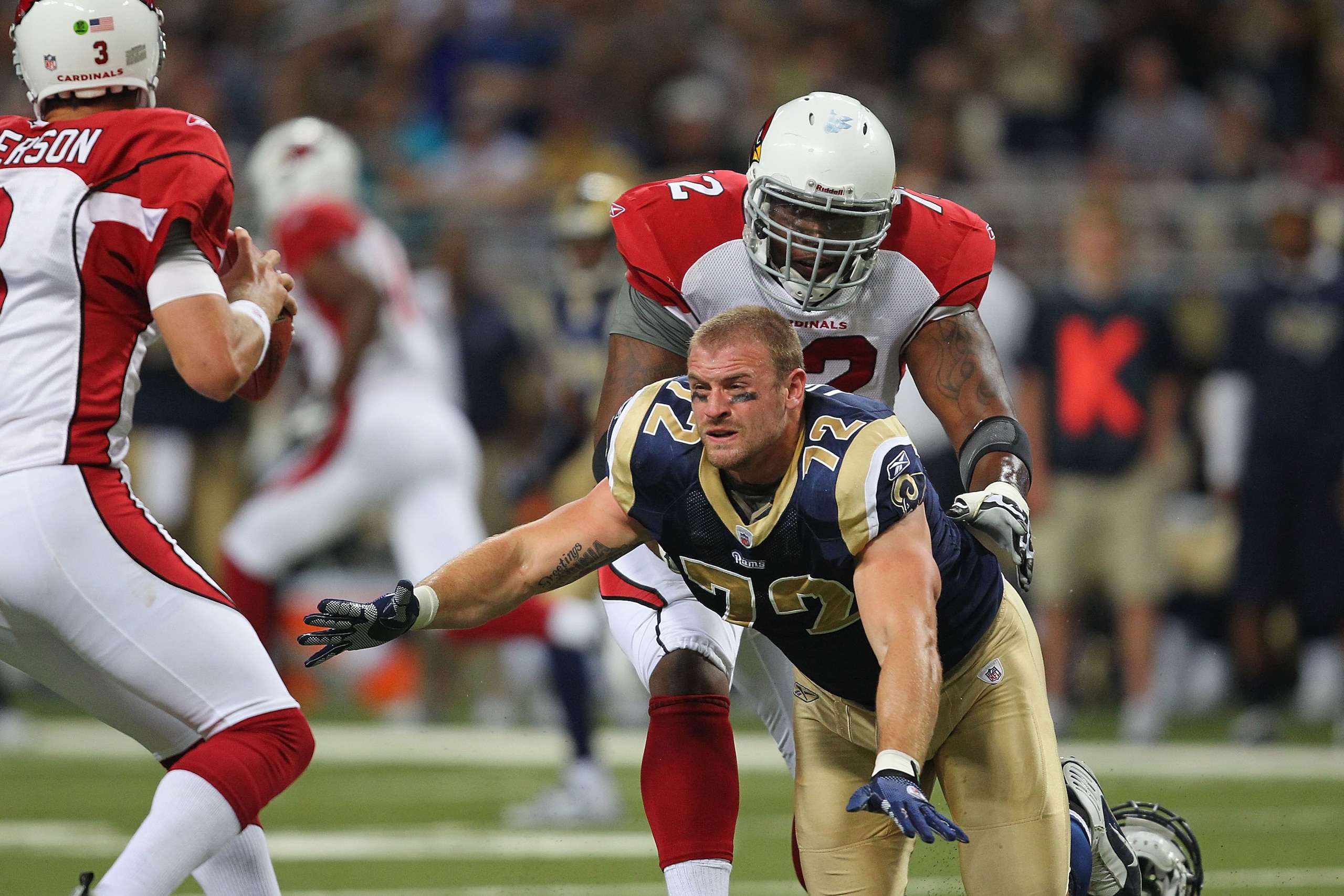 ST. LOUIS - SEPTEMBER 12: Chris Long #72 of the St. Louis Rams looks to get a sack against Brandon Keith #72 of the Arizona Cardinals during the NFL season opener at the Edward Jones Dome on September 12, 2010 in St. Louis, Missouri. The Cardinals beat t ST. LOUIS - SEPTEMBER 12: Chris Long #72 of the St. Louis Rams looks to get a sack against Brandon Keith #72 of the Arizona Cardinals during the NFL season opener at the Edward Jones Dome on September 12, 2010 in St. Louis, Missouri. The Cardinals beat t