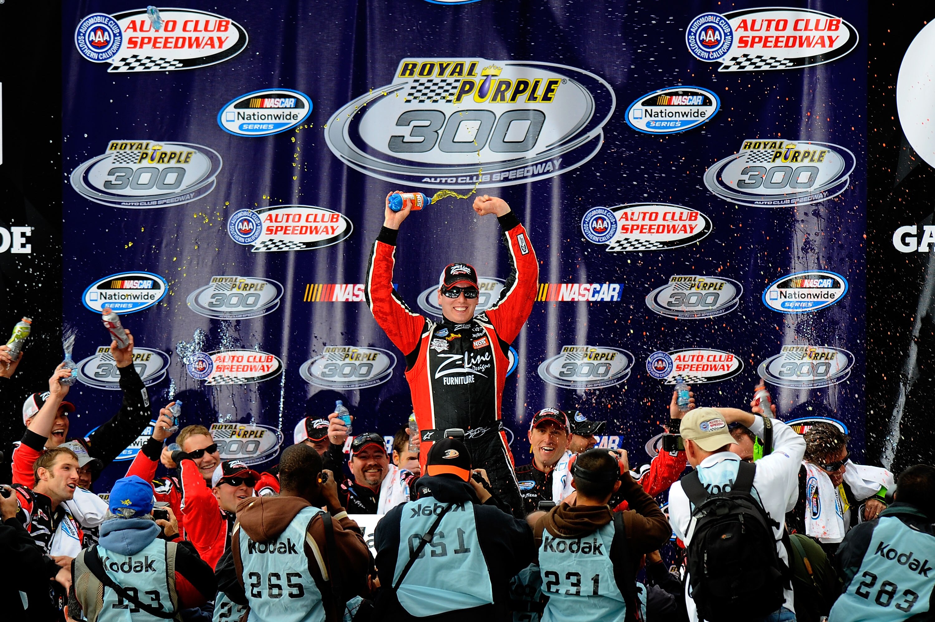 FONTANA, CA - MARCH 26:  Kyle Busch, driver of the #18 Z-Line Designs Toyota, celebrates in victory lane after winning the NASCAR Nationwide Series Royal Purple 300 at Auto Club Speedway on March 26, 2011 in Fontana, California.  (Photo by Jared C. Tilton