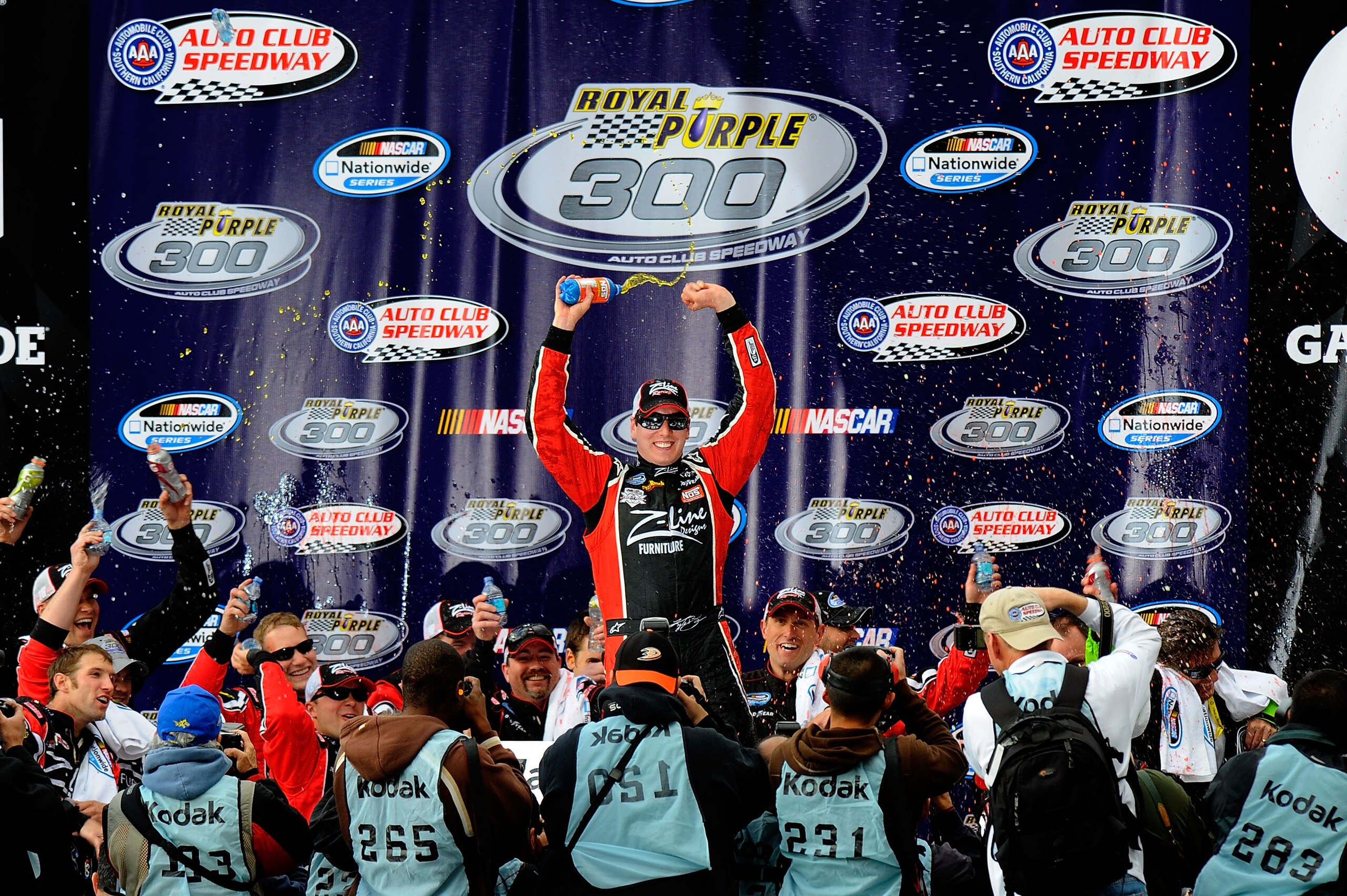 FONTANA, CA - MARCH 26:  Kyle Busch, driver of the #18 Z-Line Designs Toyota, celebrates in victory lane after winning the NASCAR Nationwide Series Royal Purple 300 at Auto Club Speedway on March 26, 2011 in Fontana, California.  (Photo by Jared C. Tilton