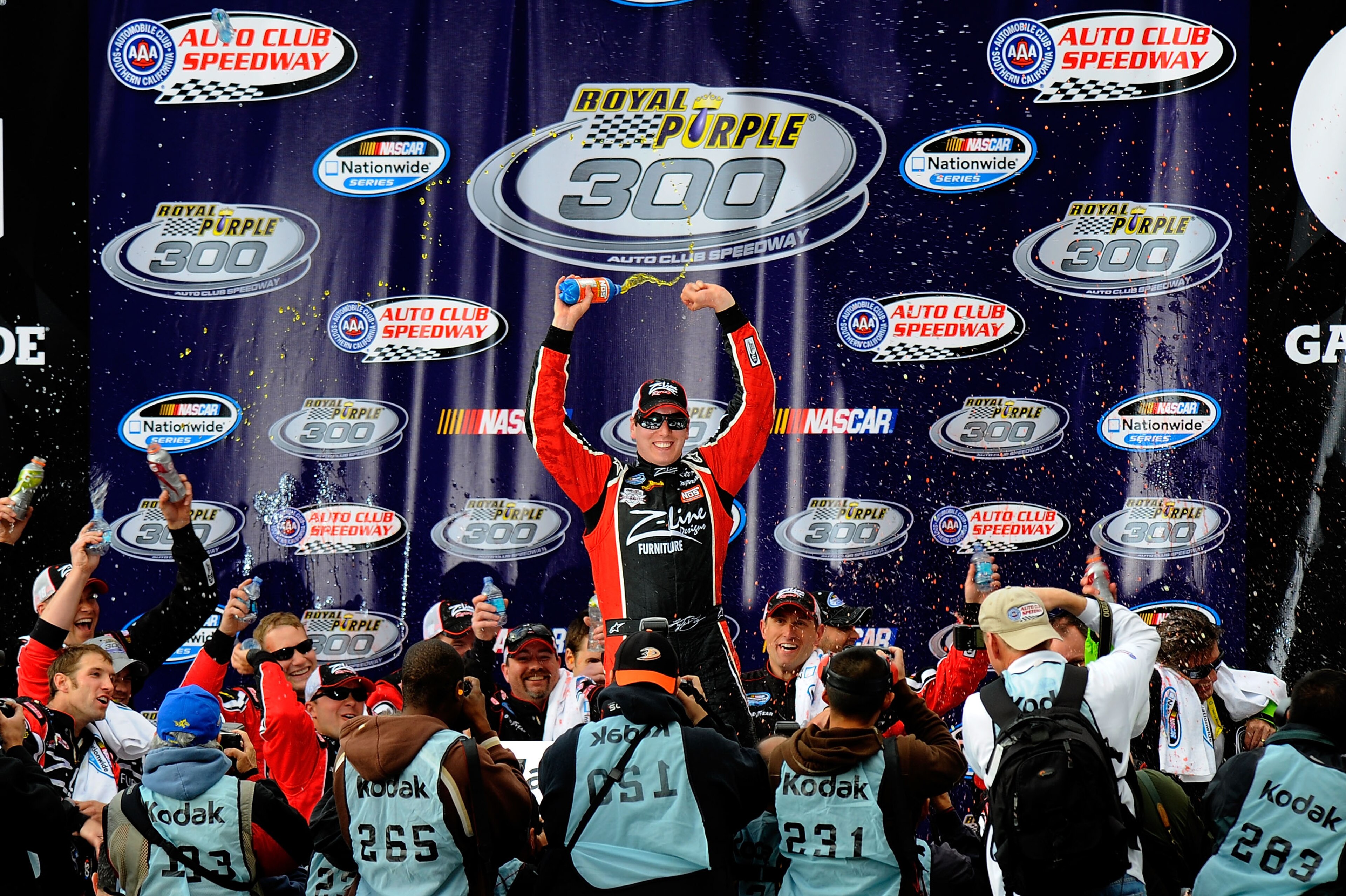 FONTANA, CA - MARCH 26:  Kyle Busch, driver of the #18 Z-Line Designs Toyota, celebrates in victory lane after winning the NASCAR Nationwide Series Royal Purple 300 at Auto Club Speedway on March 26, 2011 in Fontana, California.  (Photo by Jared C. Tilton