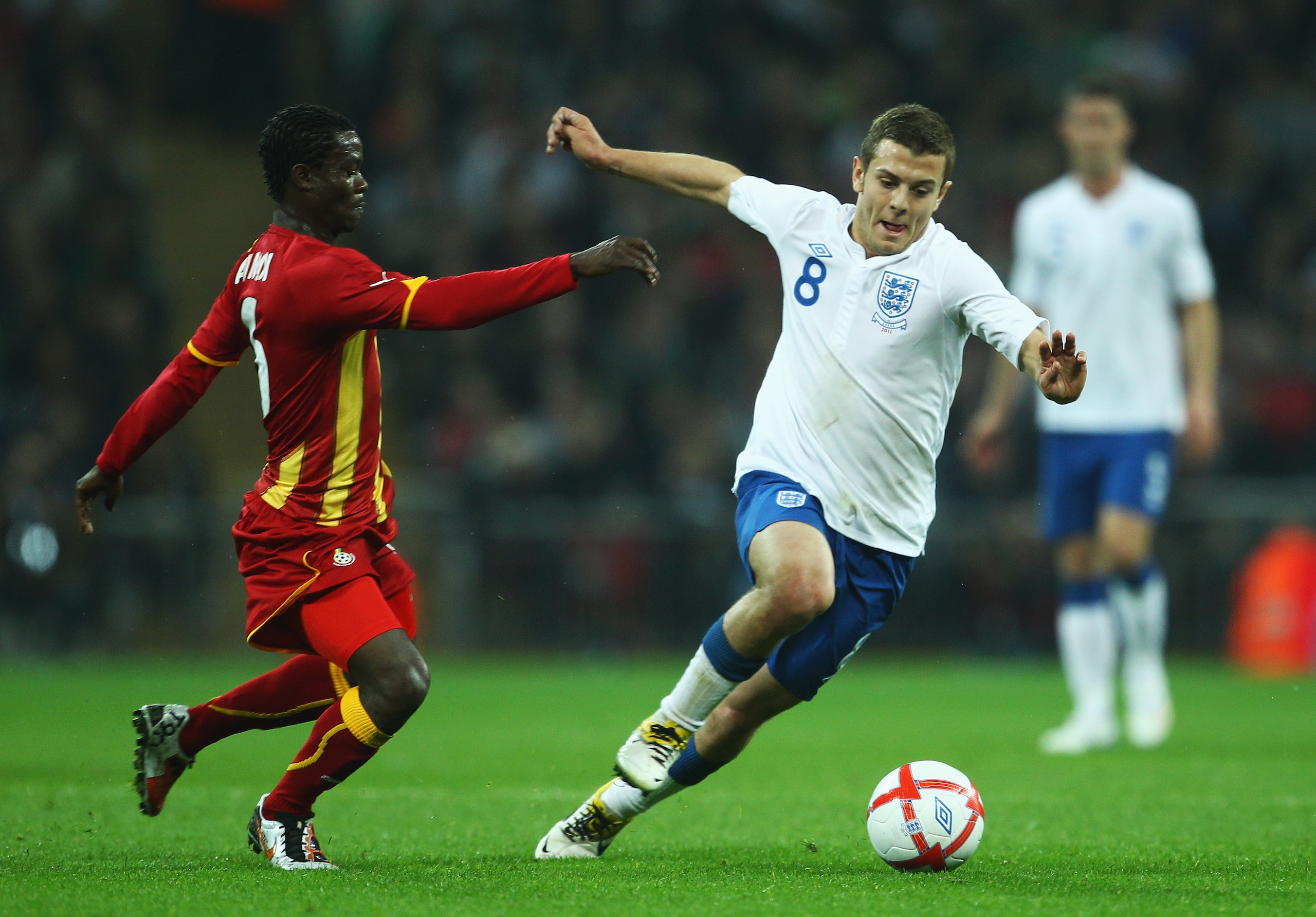 LONDON, ENGLAND - MARCH 29: Anthony Annan of Ghana (L) battles for the ball with Jack Wilshere of England during the international friendly match between England and Ghana at Wembley Stadium on March 29, 2011 in London, England. (Photo by Julian Finney/ LONDON, ENGLAND - MARCH 29: Anthony Annan of Ghana (L) battles for the ball with Jack Wilshere of England during the international friendly match between England and Ghana at Wembley Stadium on March 29, 2011 in London, England. (Photo by Julian Finney/