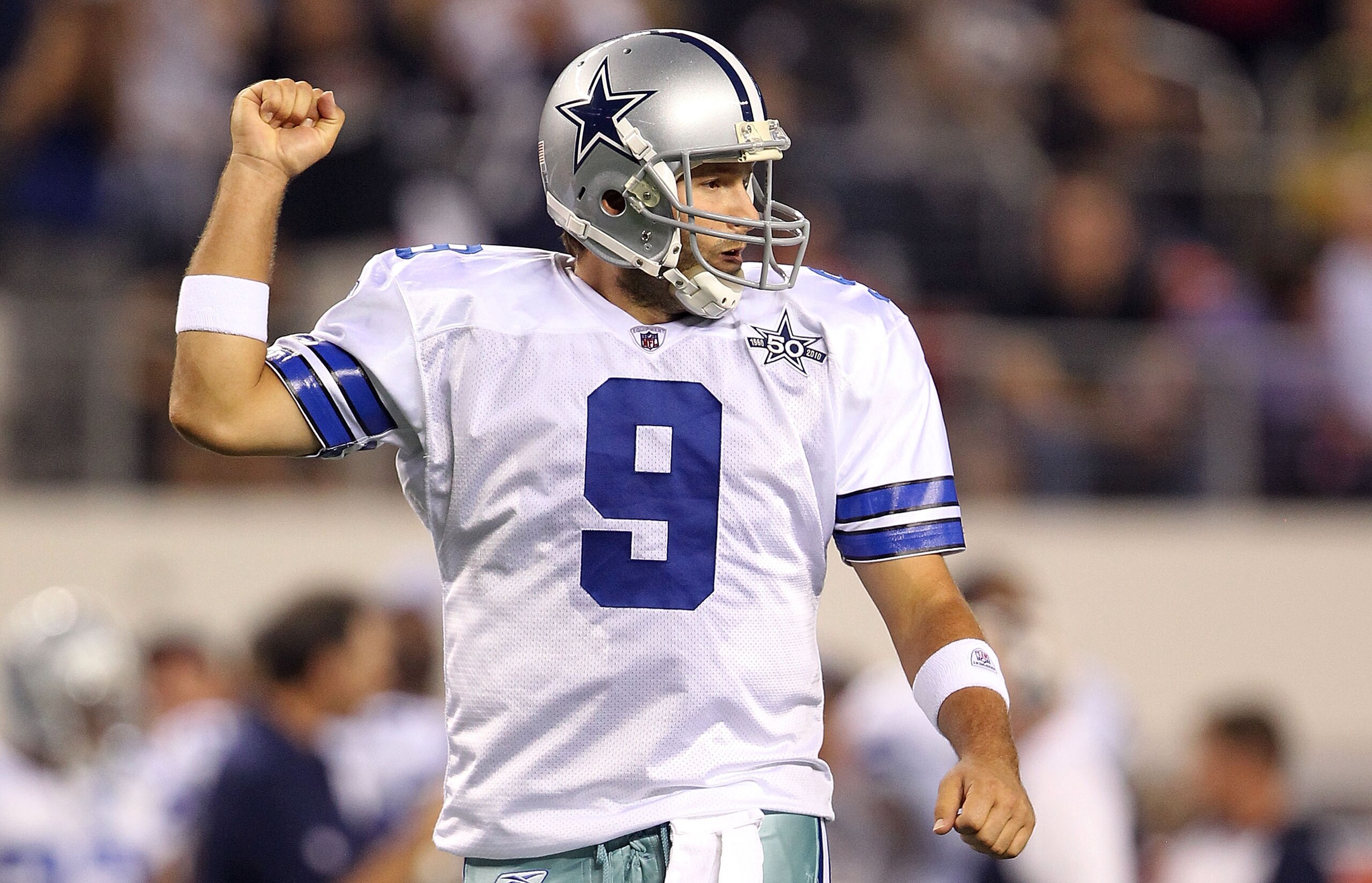 ARLINGTON, TX - OCTOBER 25: Quarterback Tony Romo #9 of the Dallas Cowboys celebrates a touchdown by Jason Witten against the New York Giants in the first quarter at Cowboys Stadium on October 25, 2010 in Arlington, Texas. (Photo by Ronald Martinez/Gett ARLINGTON, TX - OCTOBER 25: Quarterback Tony Romo #9 of the Dallas Cowboys celebrates a touchdown by Jason Witten against the New York Giants in the first quarter at Cowboys Stadium on October 25, 2010 in Arlington, Texas. (Photo by Ronald Martinez/Gett