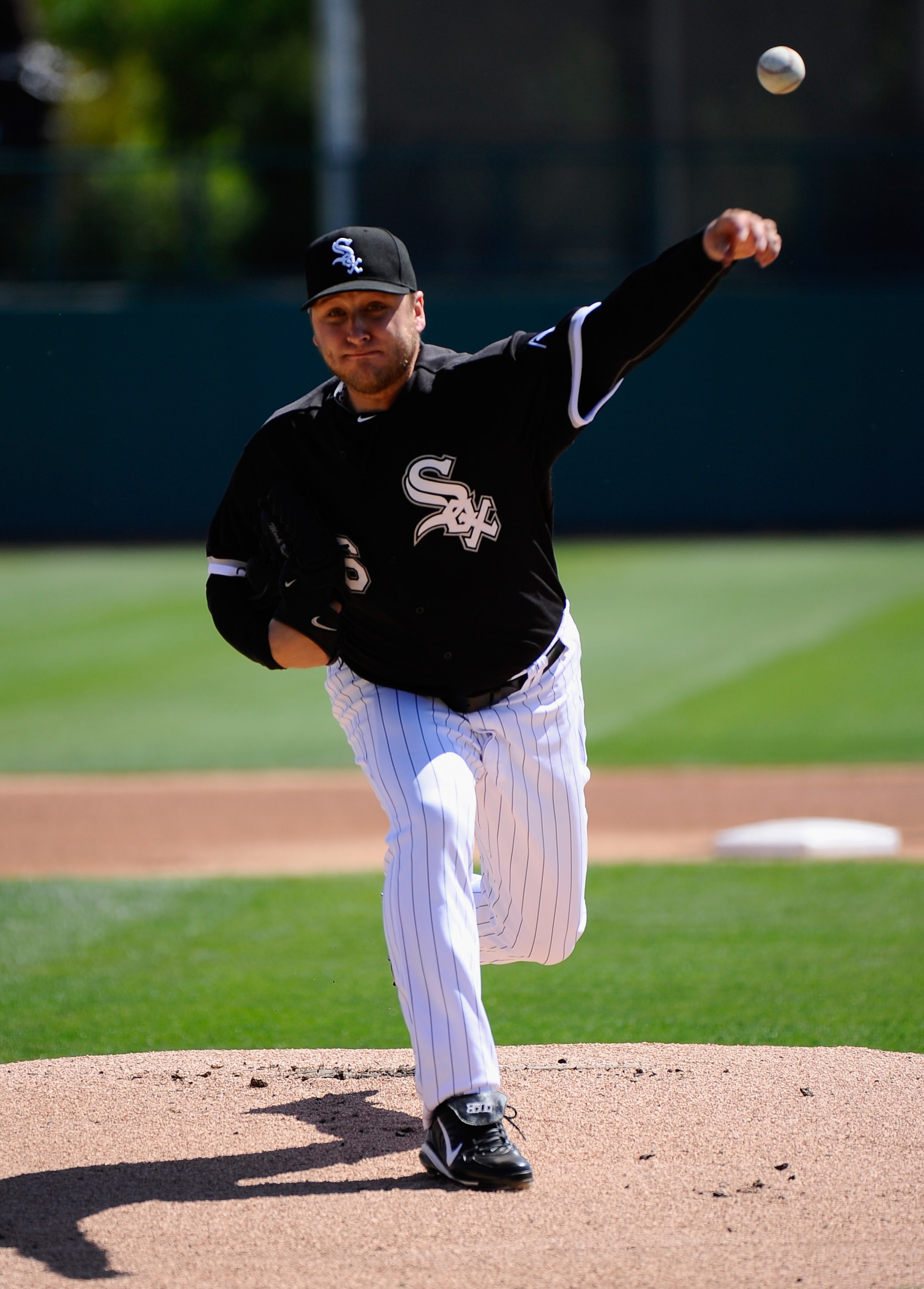 GLENDALE, AZ - MARCH 11:  Pitcher Mark Buehrle #56 of the Chicago White Sox throws a pitch prior to the start of the spring training baseball game against the Chicago Cubs at Camelback Ranch on March 11, 2011 in Glendale, Arizona.  (Photo by Kevork Djanse
