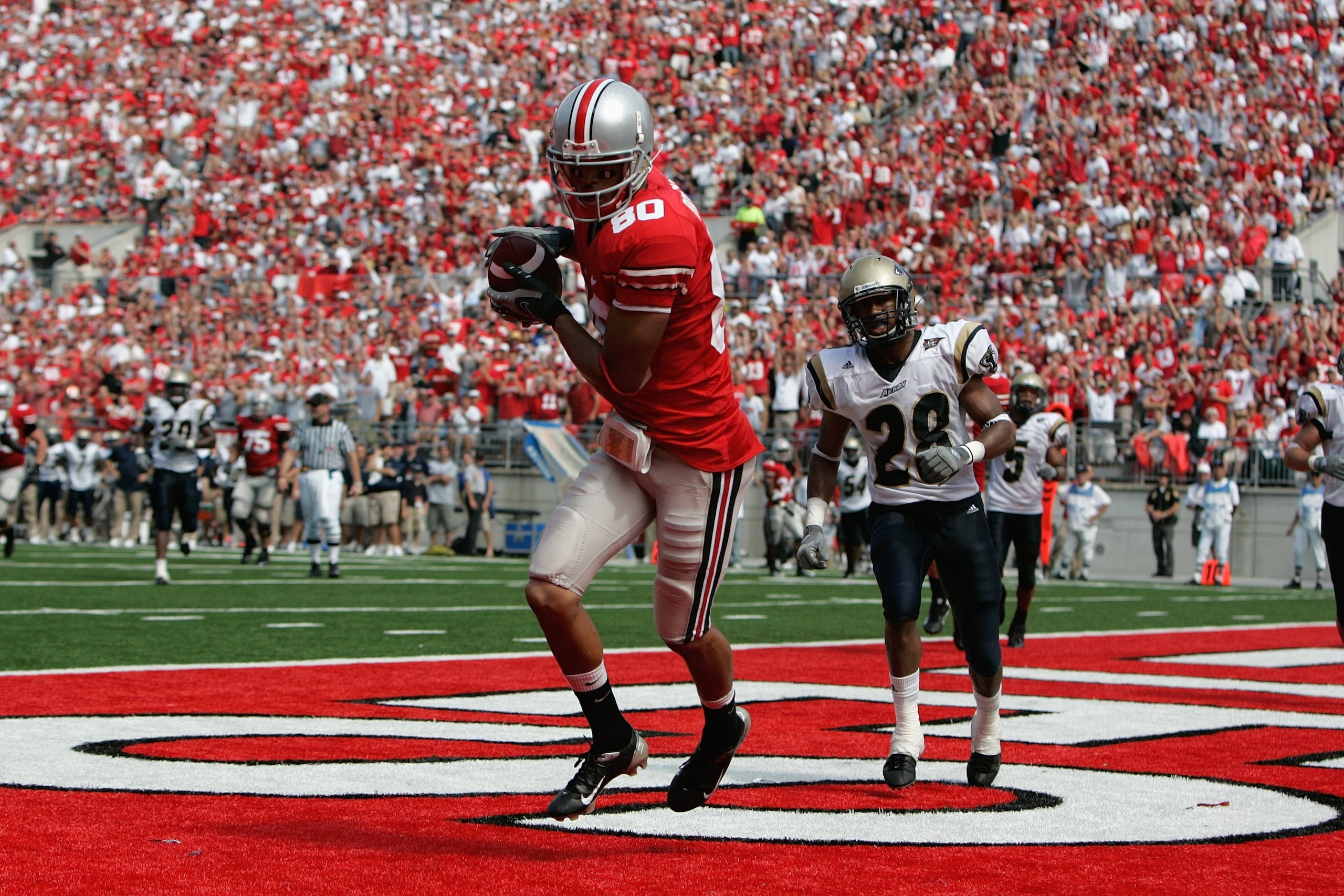 COLUMBUS, OH - SEPTEMBER 8:  Brian Robiskie #80 of the Ohio State Buckeyes scores a touchdown during the game against the Akron Zips at Ohio Stadium on September 8, 2007 in Columbus, Ohio. Ohio State won 20-2. (Photo by David Maxwell/Getty Images)