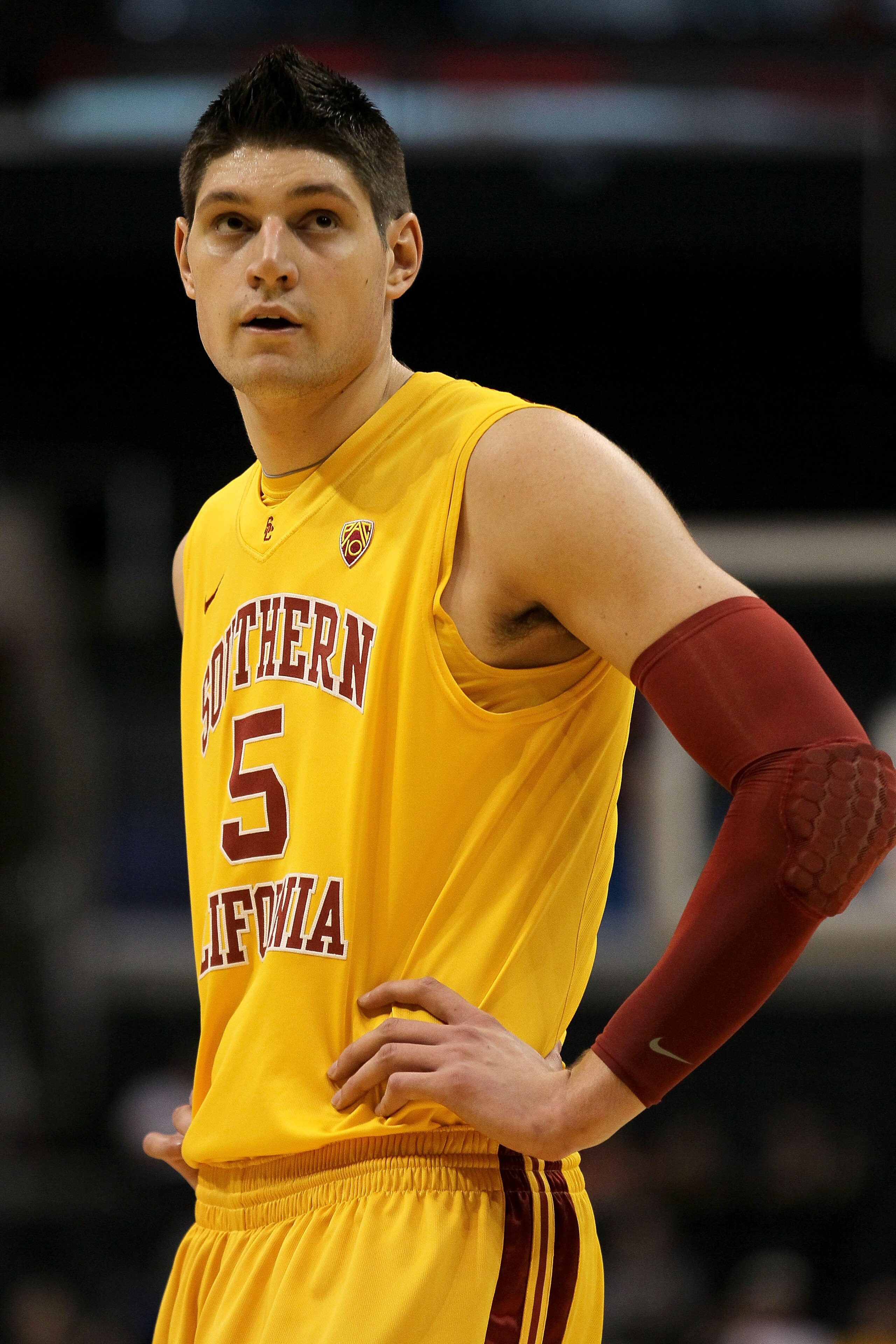 LOS ANGELES, CA - MARCH 10:  Nikola Vucevic #5 of the USC Trojans looks on while taking on the California Golden Bears in the quarterfinals of the 2011 Pacific Life Pac-10 Men's Basketball Tournament at Staples Center on March 10, 2011 in Los Angeles, Cal