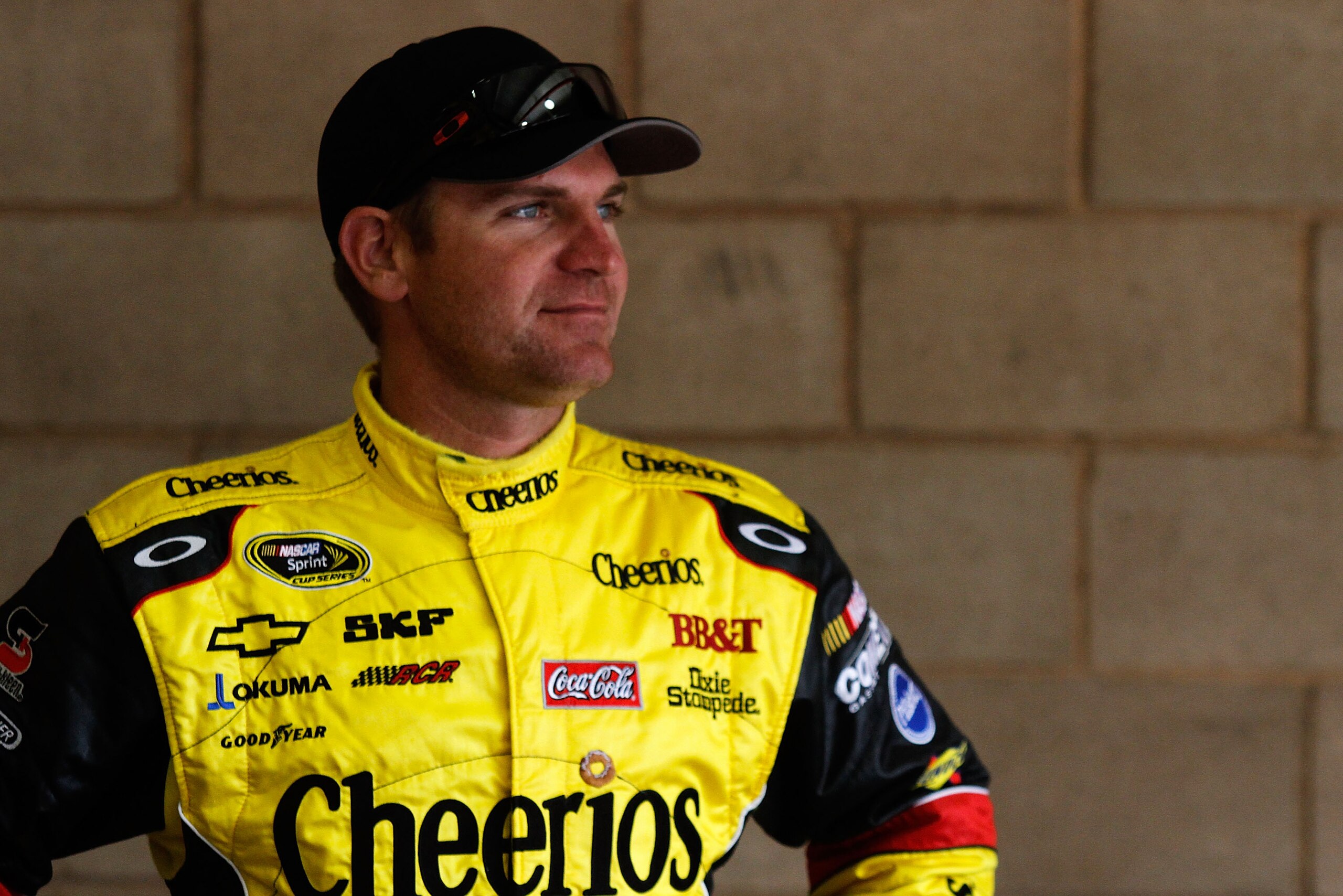 FONTANA, CA - MARCH 26:  Clint Bowyer, driver of the #33 Ronald Regan Foundation Chevrolet, stands in the garage area during practice for the NASCAR Sprint Cup Series Auto Club 400 at Auto Club Speedway on March 26, 2011 in Fontana, California.  (Photo by
