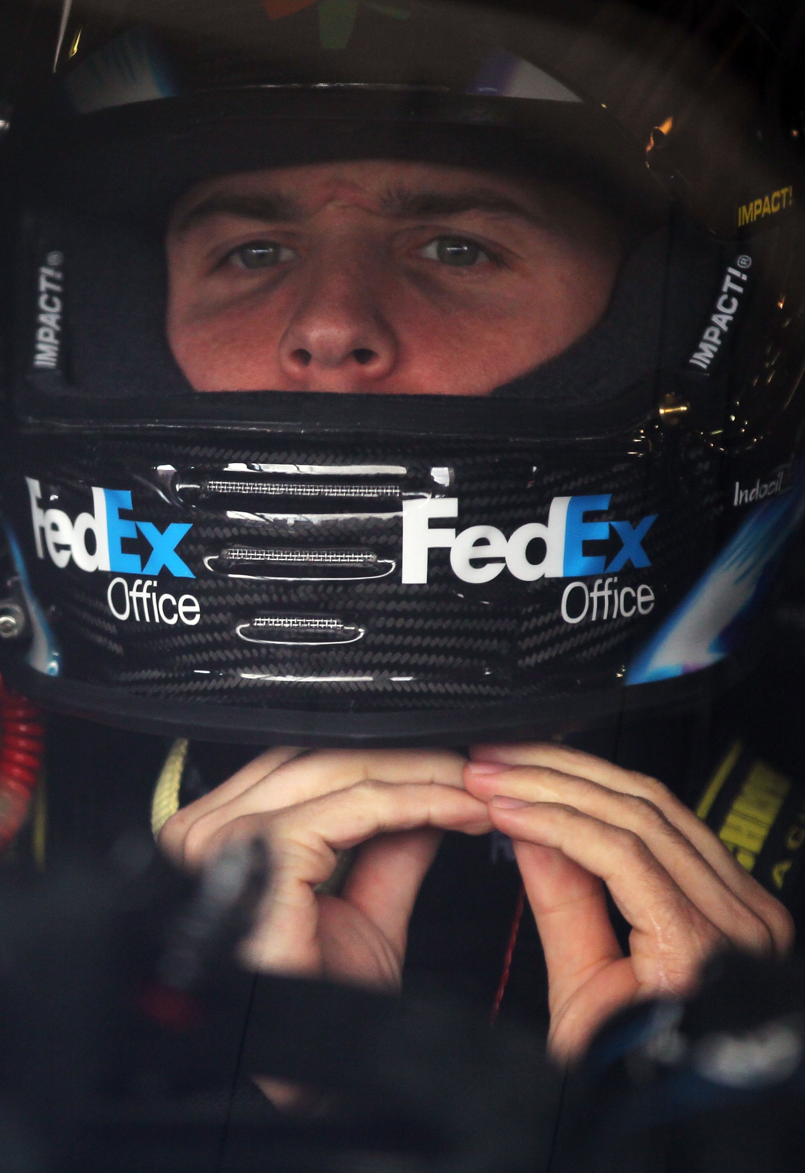 FONTANA, CA - MARCH 26:  Denny Hamlin, driver of the #11 FedEx Toyota, sits in his car during practice for the NASCAR Sprint Cup Series Auto Club 400 at Auto Club Speedway on March 26, 2011 in Fontana, California.  (Photo by Jeff Gross/Getty Images for NA