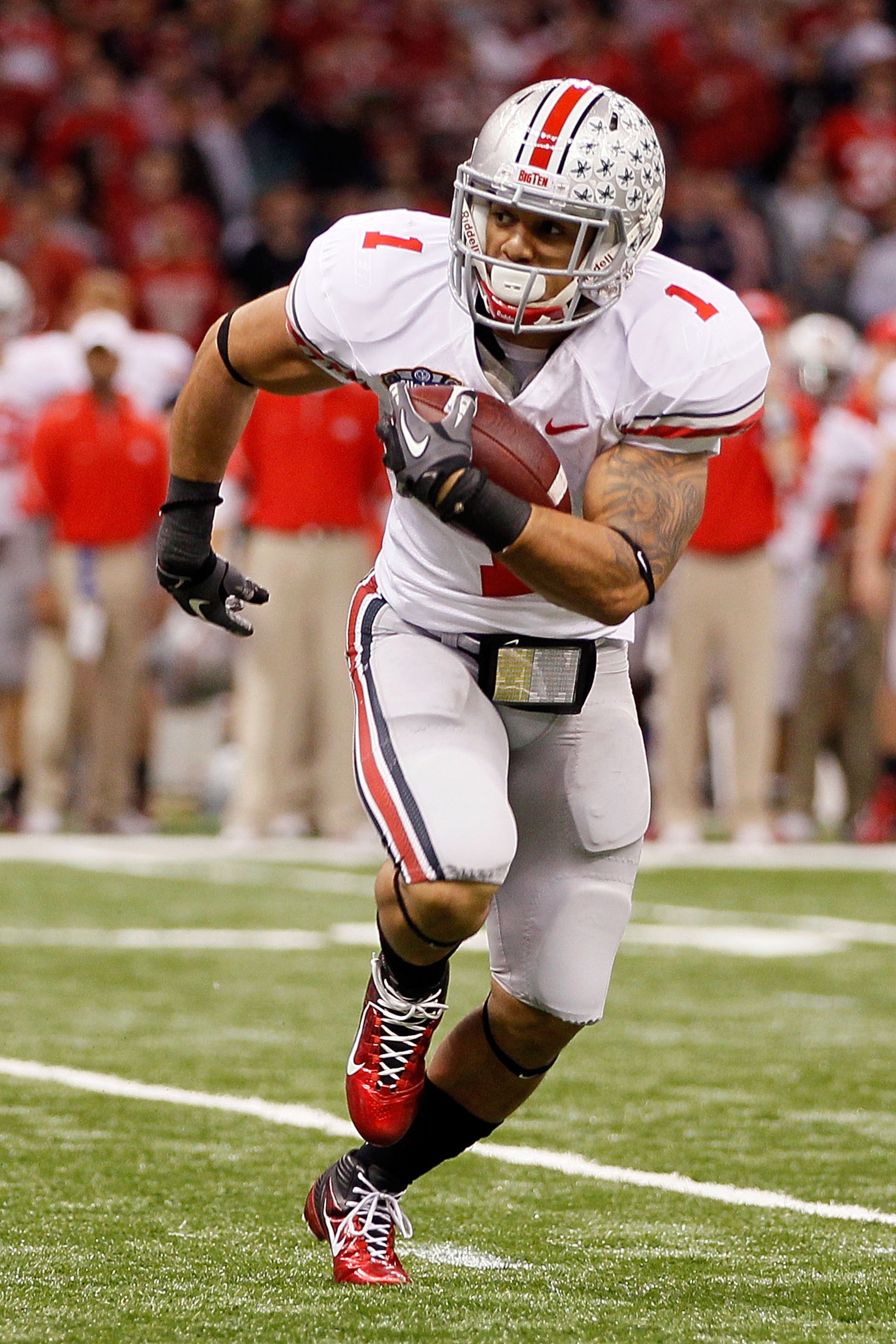 NEW ORLEANS, LA - JANUARY 04:  Dan Herron #1 of the Ohio State Buckeyes runs the ball against the Arkansas Razorbacks during the Allstate Sugar Bowl at the Louisiana Superdome on January 4, 2011 in New Orleans, Louisiana.  (Photo by Kevin C. Cox/Getty Ima