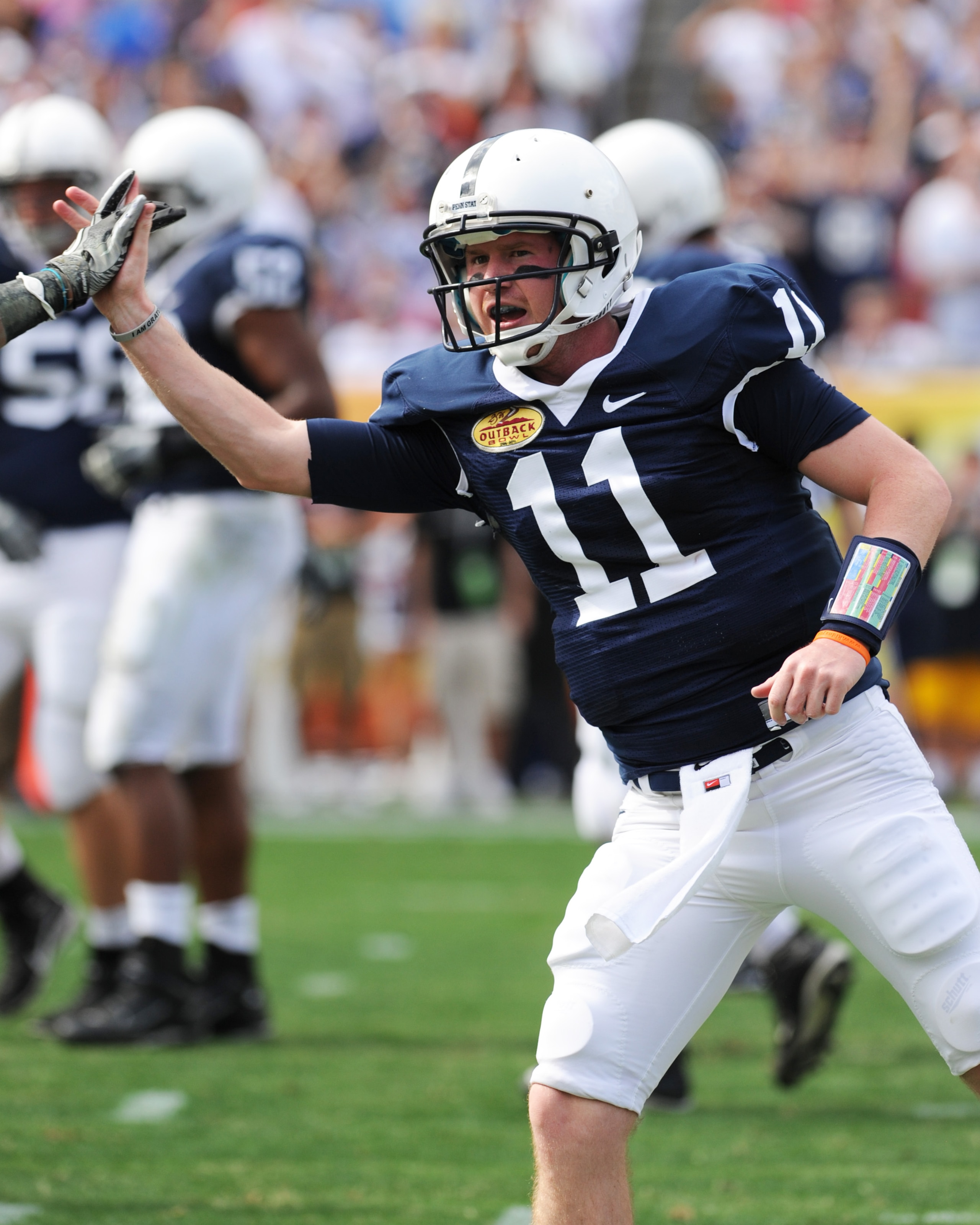 TAMPA, FL - JANUARY 1:  Quarterback Matt McGloin #11 of the Penn State Nittany Lions celebrates a touchdown pass against the Florida Gators January 1, 2011 in the 25th Outback Bowl at Raymond James Stadium in Tampa, Florida.  (Photo by Al Messerschmidt/Ge