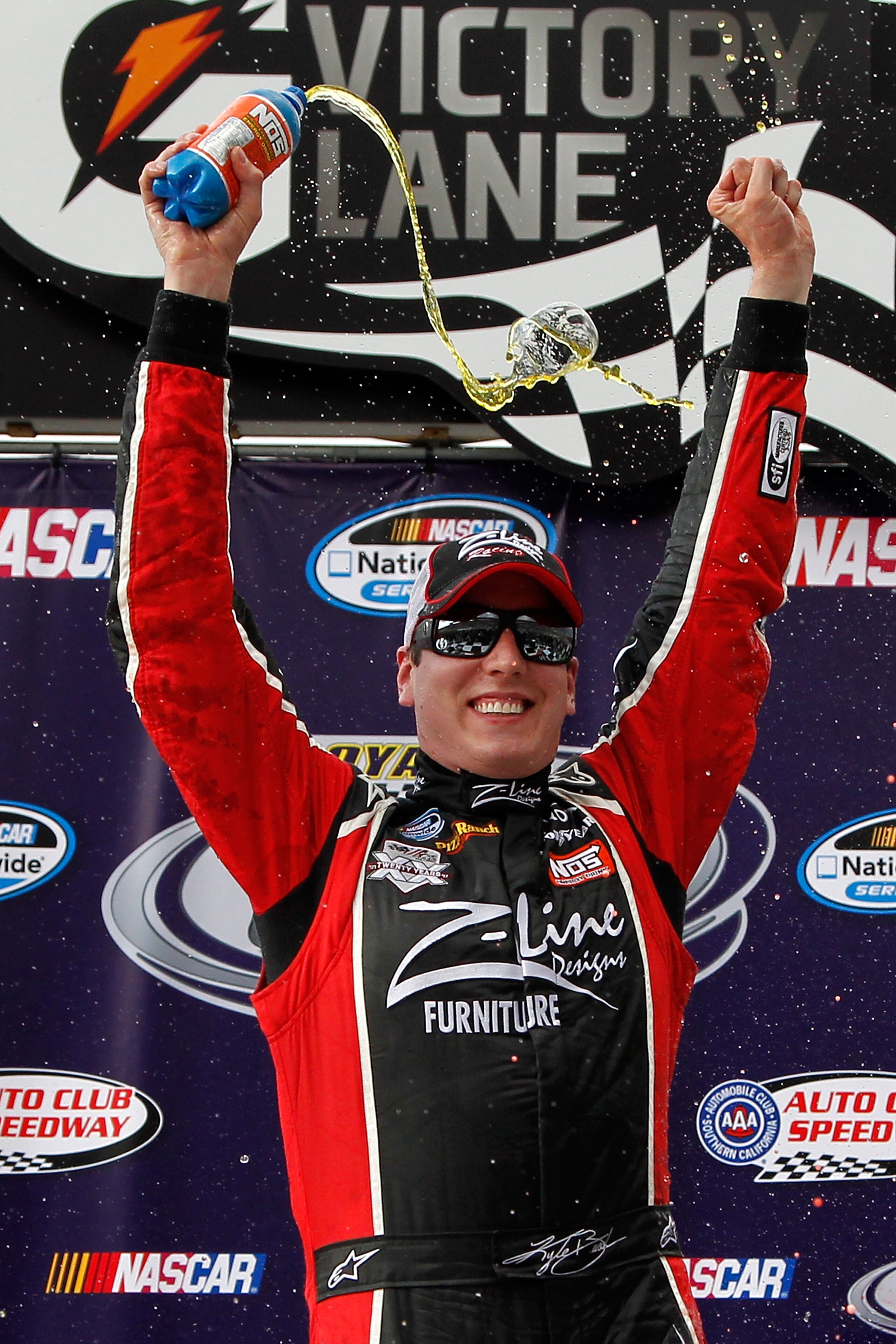 FONTANA, CA - MARCH 26:  Kyle Busch, driver of the #18 Z-Line Designs Toyota, celebrates in victory lane after winning the NASCAR Nationwide Series Royal Purple 300 at Auto Club Speedway on March 26, 2011 in Fontana, California.  (Photo by Tom Pennington/