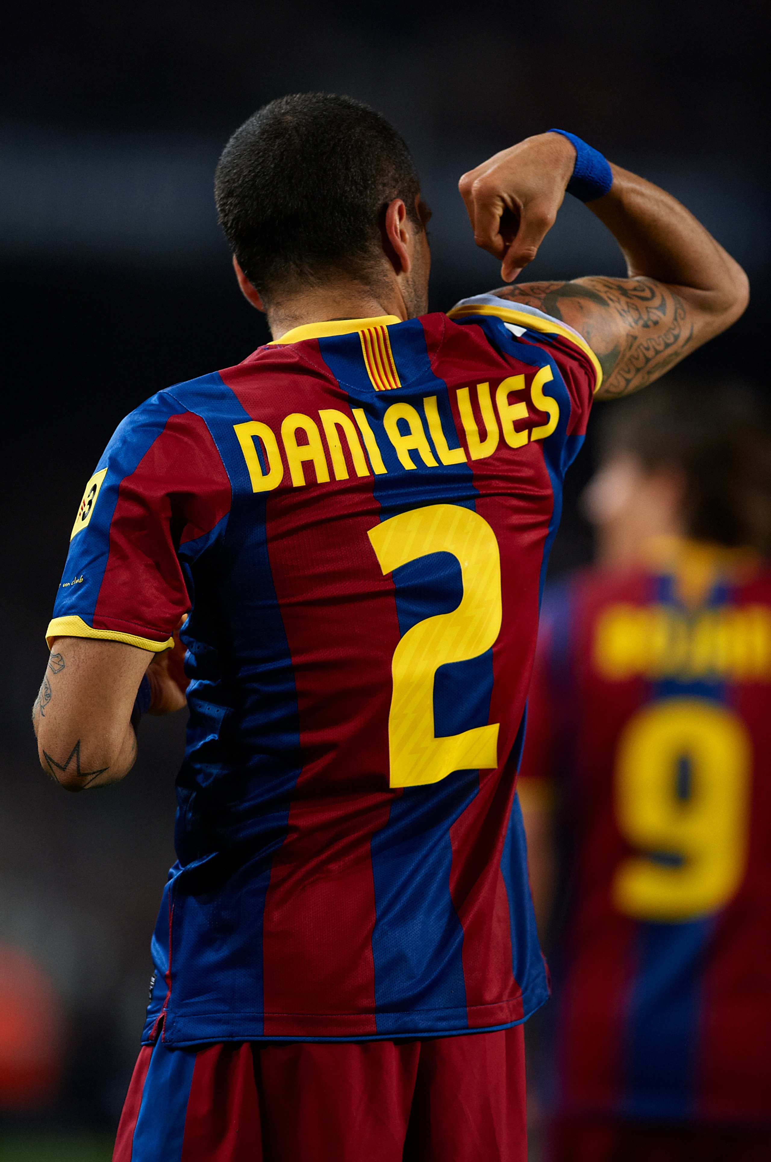 BARCELONA, SPAIN - MARCH 19:  Daniel Alves of Barcelona celebrates after scoring the opening goal during the La Liga match between Barcelona and Getafe at Camp Nou on March 19, 2011 in Barcelona, Spain.  (Photo by Manuel Queimadelos Alonso/Getty Images)