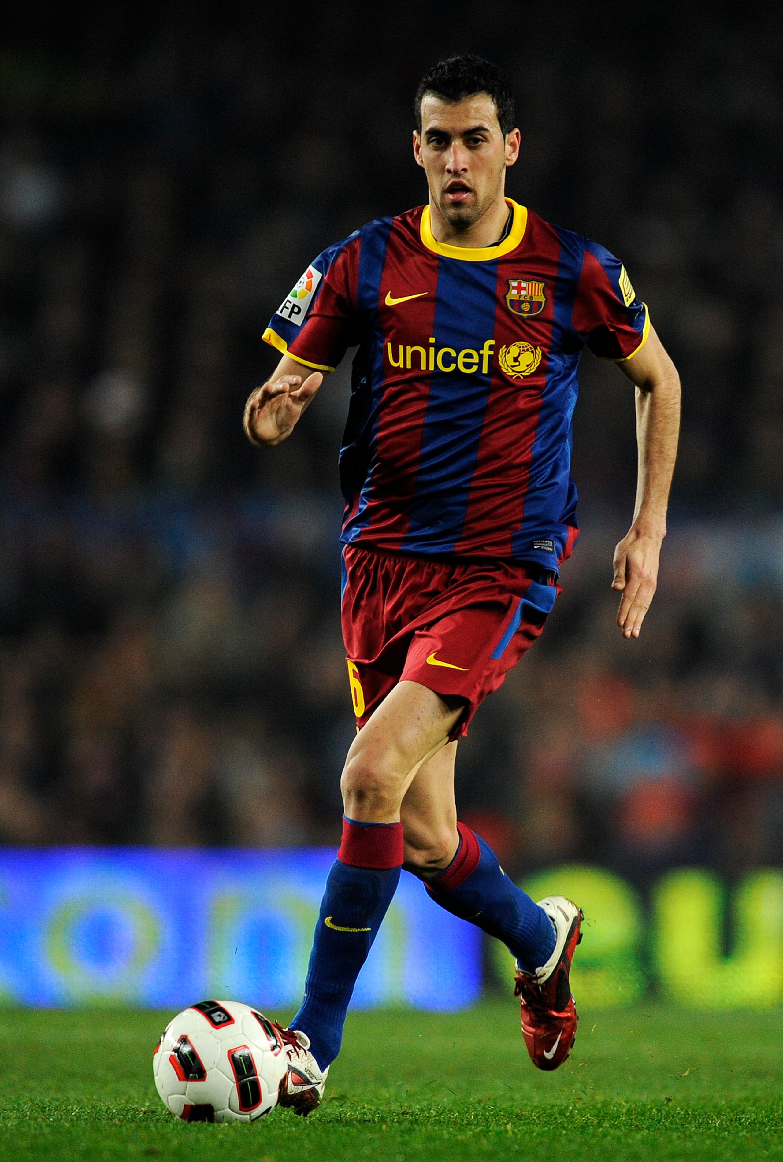BARCELONA, SPAIN - FEBRUARY 05:  Sergio Busquets of Barcelona runs with the ball during the La Liga match between Barcelona and Atletico de Madrid at Camp Nou on February 5, 2011 in Barcelona, Spain. Barcelona won 3-0.  (Photo by David Ramos/Getty Images)