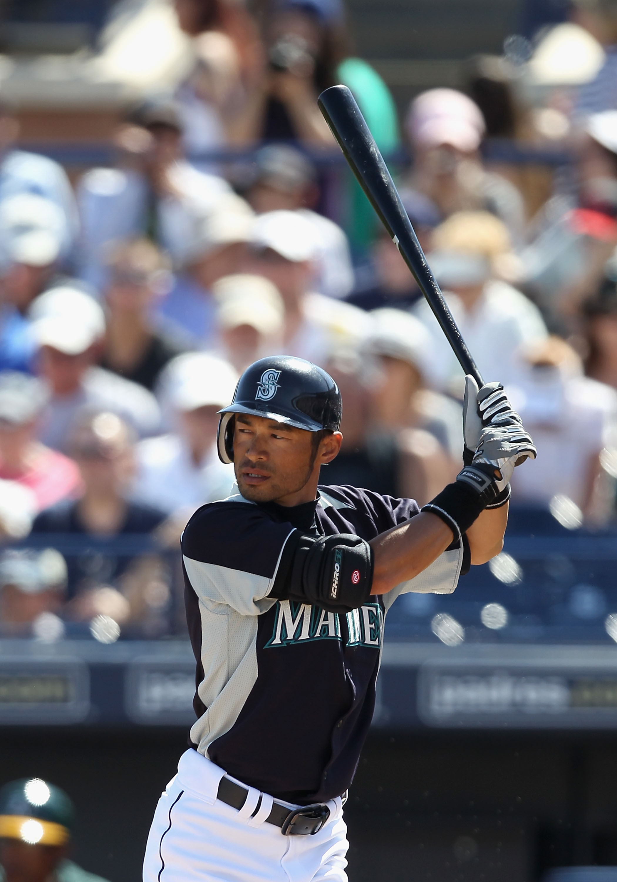 Jun 03, 2001; Oakland, CA, USA; Seattle Mariners' Ichiro Suzuki, #51,  throws his bat as he runs to first base after hitting a grounder in the  first inning against the Oakland Athletics