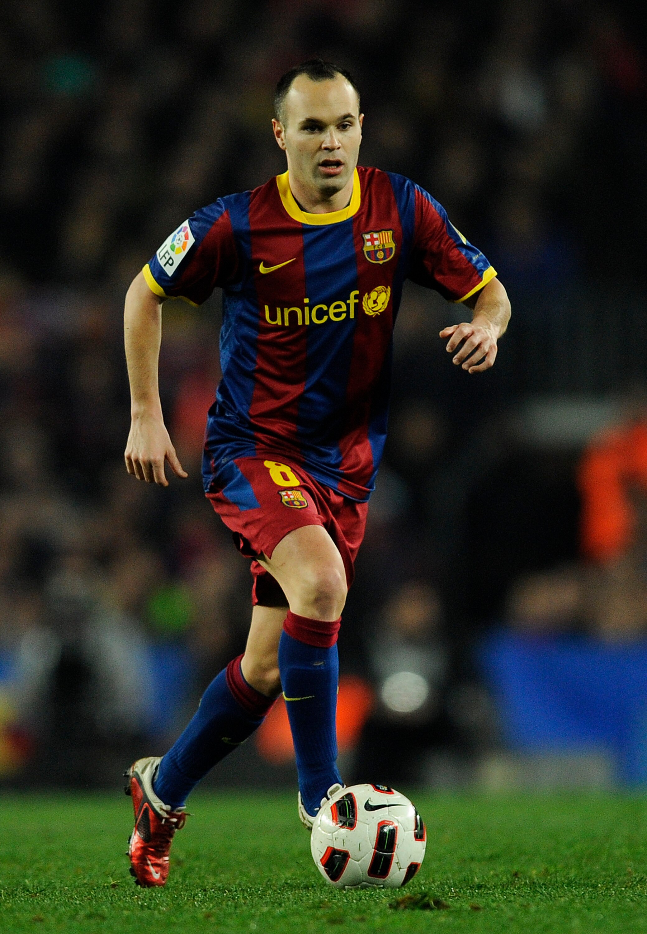 BARCELONA, SPAIN - FEBRUARY 05:  Andres Iniesta of Barcelona runs with the ball during the La Liga match between Barcelona and Atletico de Madrid at Camp Nou on February 5, 2011 in Barcelona, Spain. Barcelona won 3-0.  (Photo by David Ramos/Getty Images)