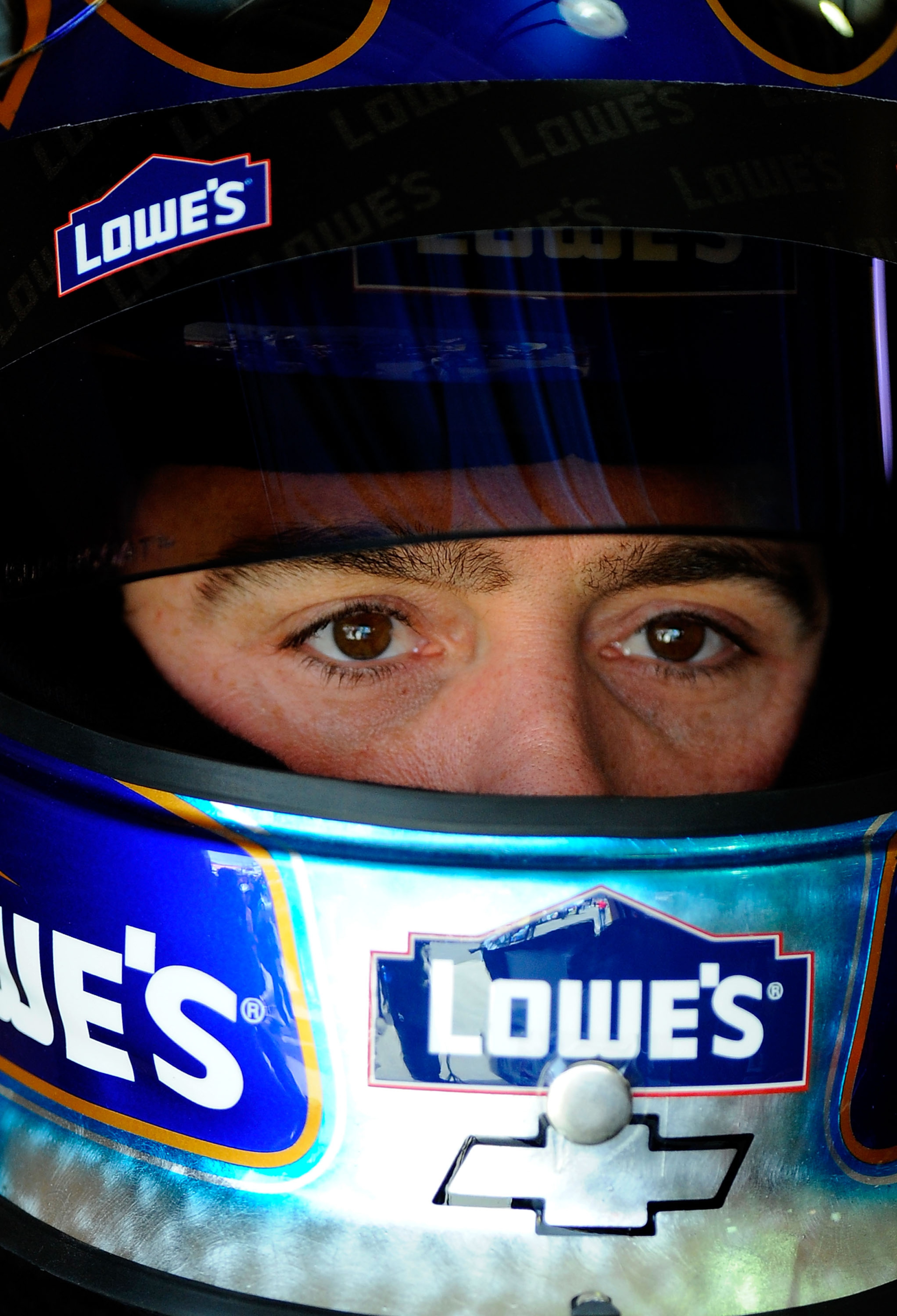 FONTANA, CA - MARCH 26:  Jimmie Johnson, driver of the #48 Lowe's Chevrolet, sits in his car during practice for the NASCAR Sprint Cup Series Auto Club 400 at Auto Club Speedway on March 26, 2011 in Fontana, California.  (Photo by Jared C. Tilton/Getty Im