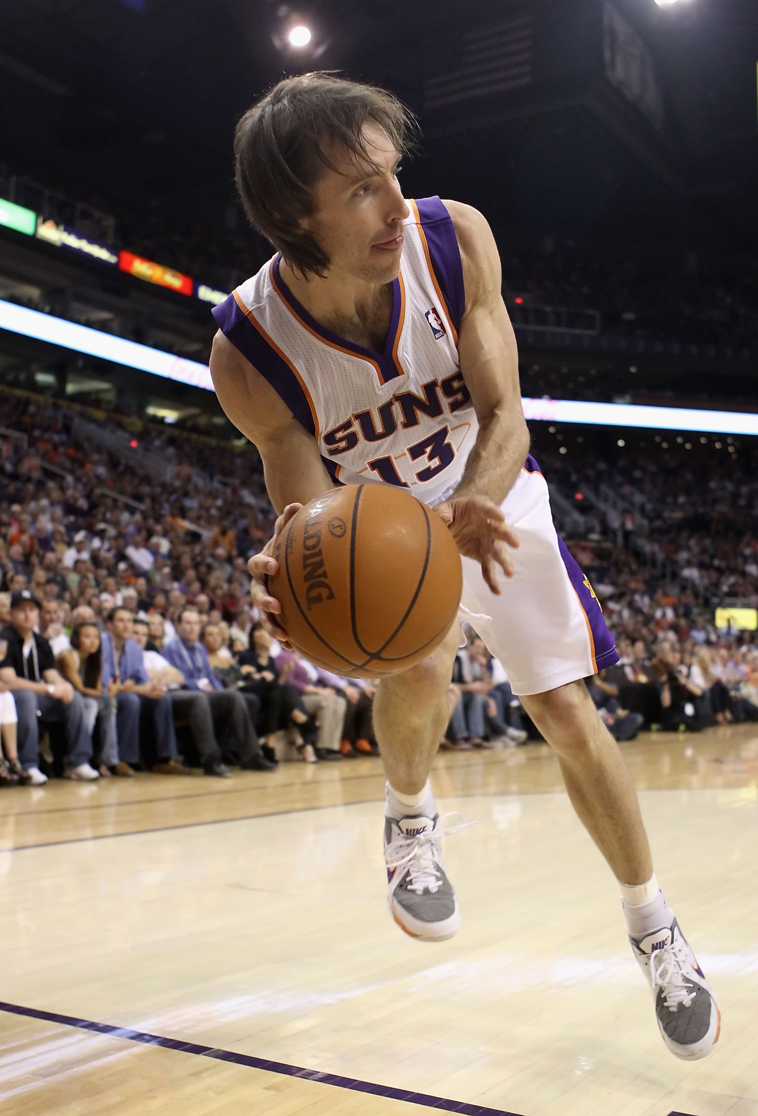 PHOENIX, AZ - MARCH 27:  Steve Nash #13 of the Phoenix Suns handles the ball against the Dallas Mavericks during the NBA game at US Airways Center on March 27, 2011 in Phoenix, Arizona.  The Mavericks defeated the Suns 91-83. NOTE TO USER: User expressly