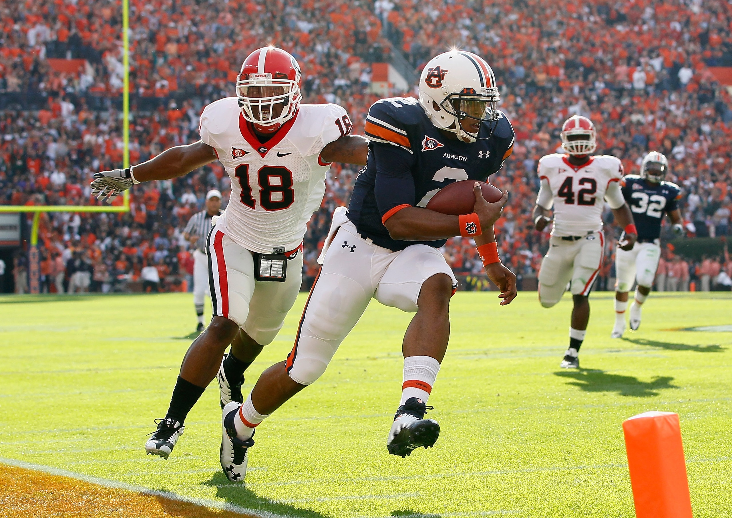 AUBURN, AL - NOVEMBER 13:  Quarterback Cameron Newton #2 of the Auburn Tigers rushes for a touchdown past Bacarri Rambo #18 of the Georgia Bulldogs at Jordan-Hare Stadium on November 13, 2010 in Auburn, Alabama.  (Photo by Kevin C. Cox/Getty Images)