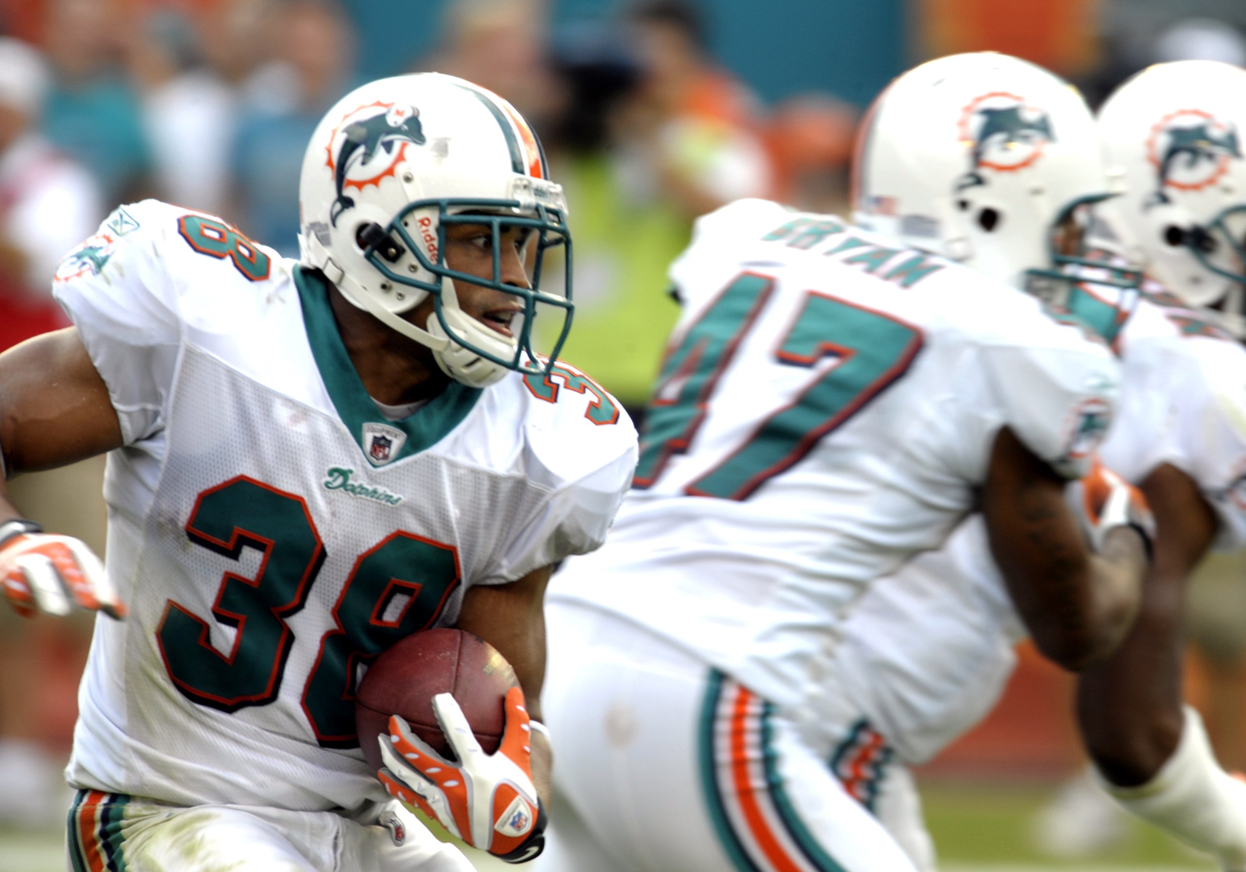 MIAMI, FL - JANUARY 4:  Running back Patrick Cobbs #38 of the Miami Dolphins returns a kick against the Baltimore Ravens in an NFL Wildcard Playoff Game at Dolphins Stadium on January 4, 2009 in Miami, Florida.  (Photo by Al Messerschmidt/Getty Images)
