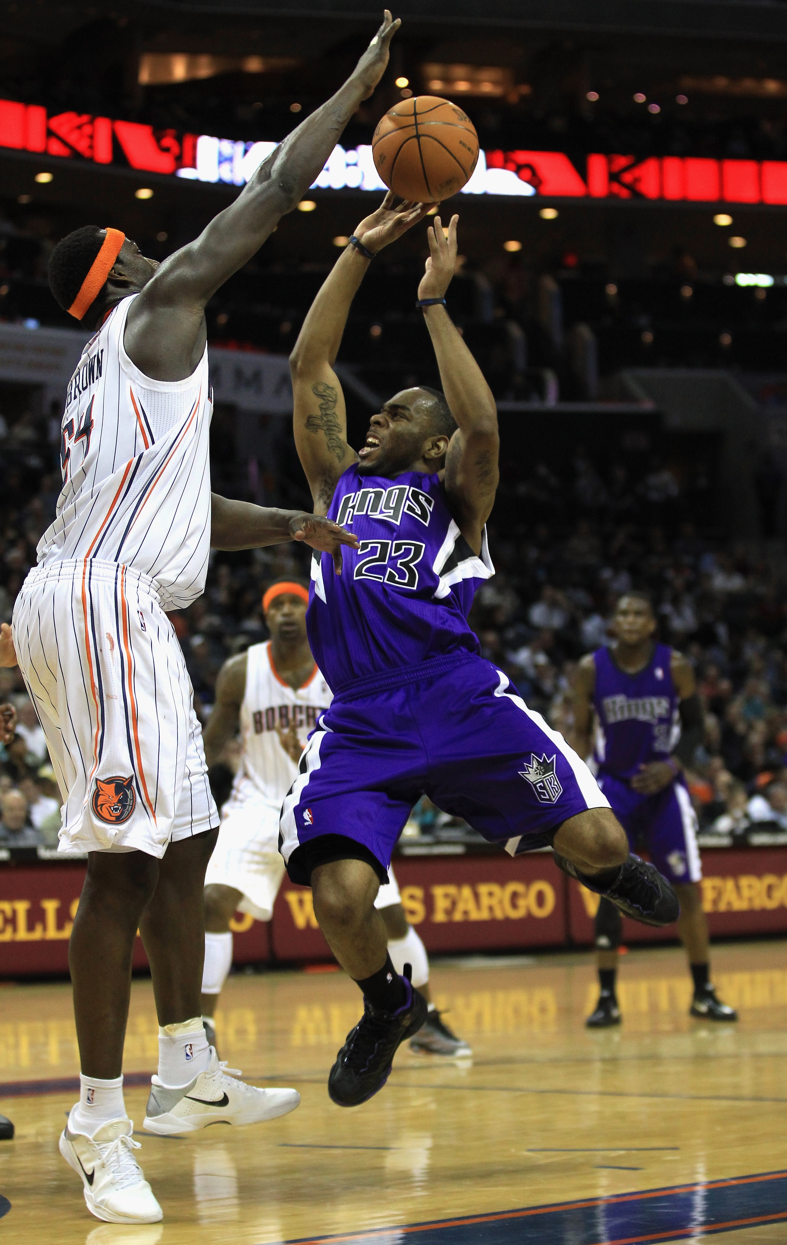 CHARLOTTE, NC - FEBRUARY 25:  Samuel Dalembert #10 of the Sacramento Kings shoots the ball over Kwame Brown #54 of the Charlotte Bobcats during their game at Time Warner Cable Arena on February 25, 2011 in Charlotte, North Carolina. NOTE TO USER: User exp