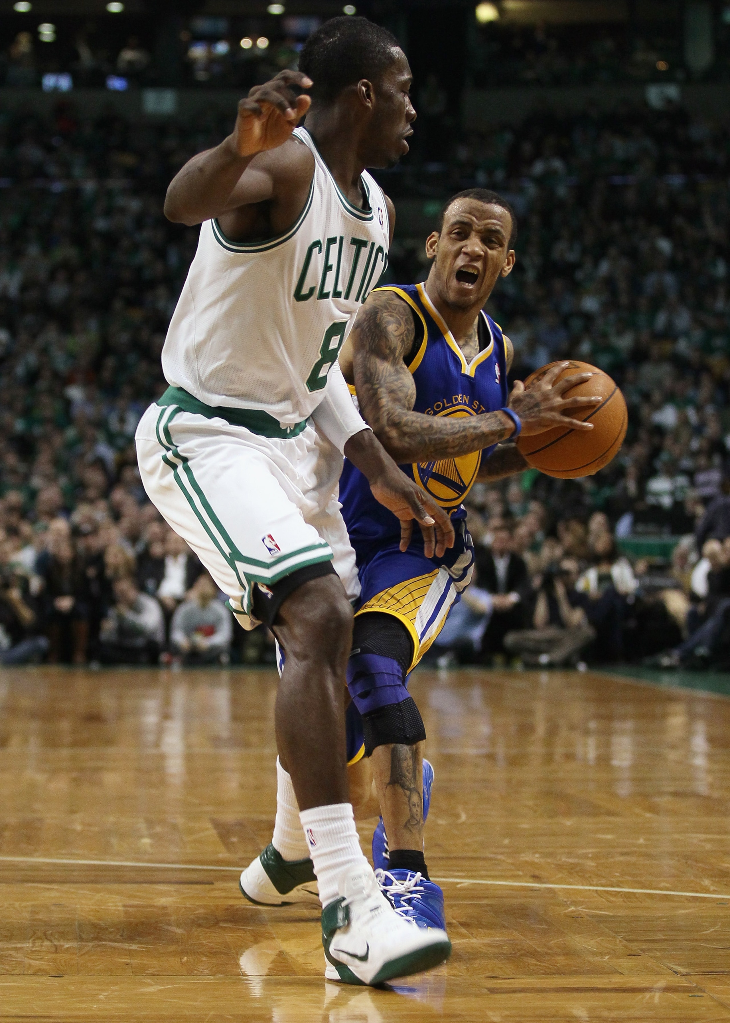 BOSTON, MA - MARCH 04:  Monta Ellis #8 of the Golden State Warriors tries to get around Jeff Green #8 of the Boston Celtics on March 4, 2011 at the TD Garden in Boston, Massachusetts.  The Celtics defeated the Warriors 107-103. NOTE TO USER: User expressl
