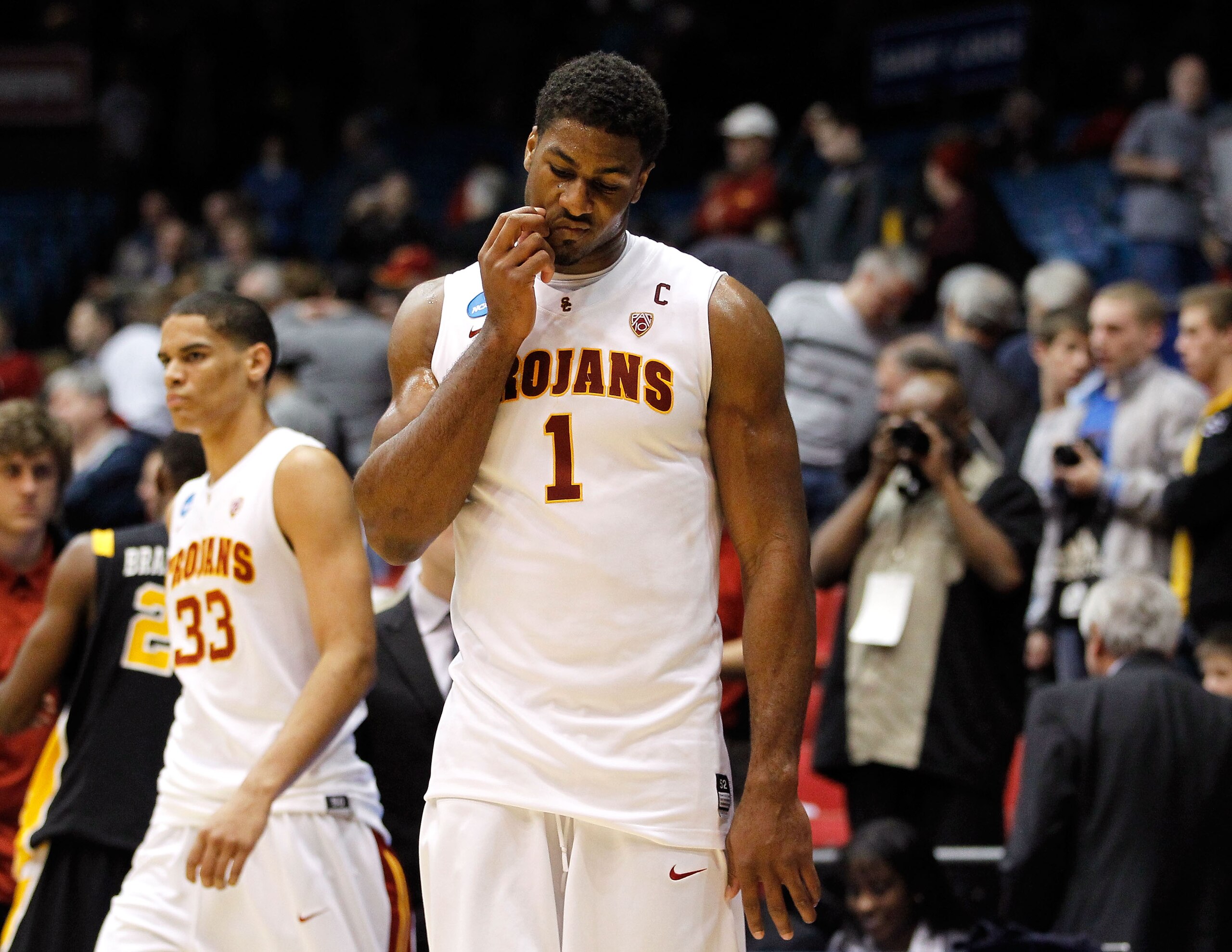 DAYTON, OH - MARCH 16: Alex Stepheson #1 and Garrett Jackson #33 of the USC Trojans walk off the court after being defeated by the Virginia Commonwealth Rams during the first round of the 2011 NCAA men's basketball tournament at UD Arena on March 16, 2011