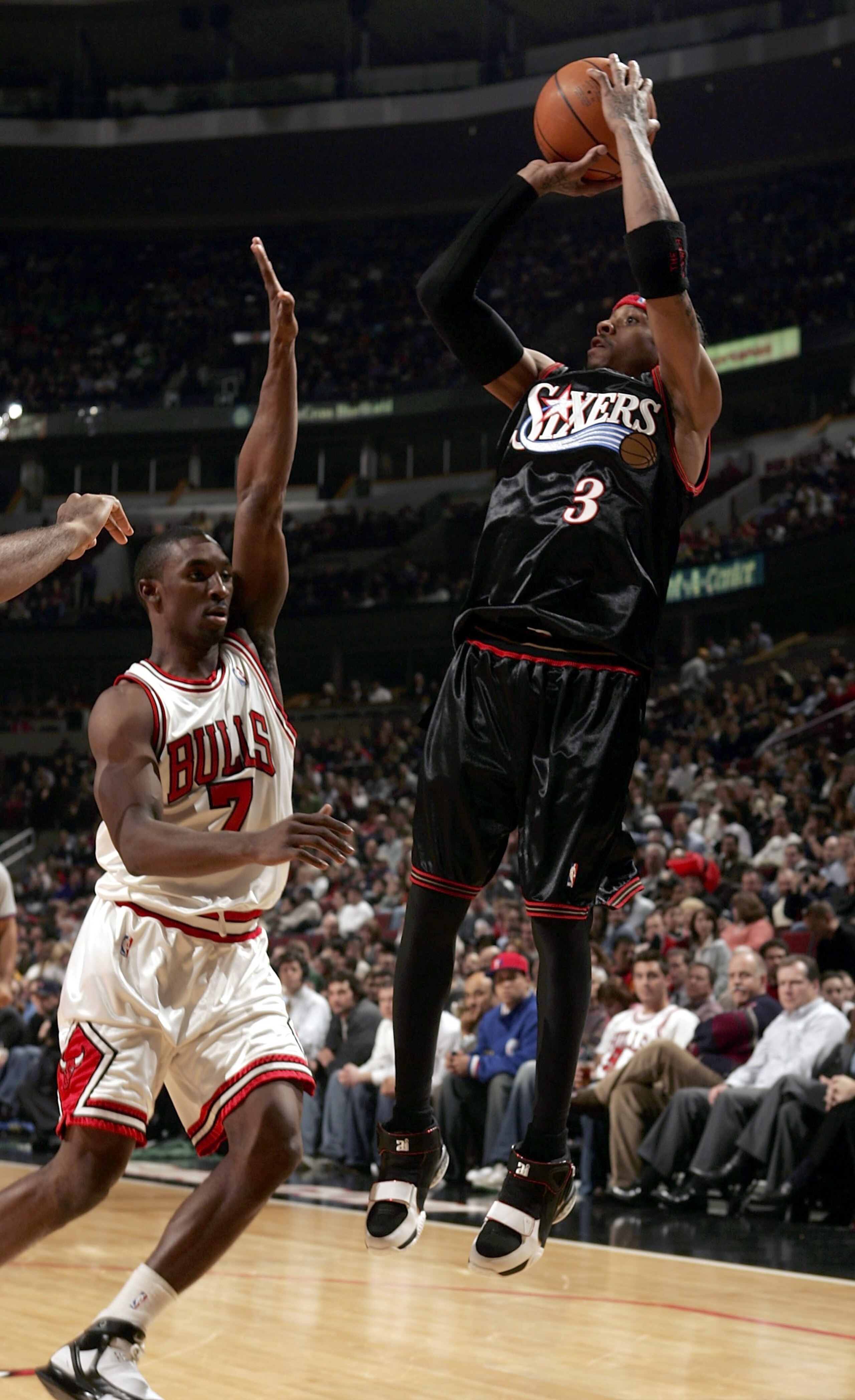 CHICAGO - FEBRUARY 16:  Allen Iverson #3 of the Philadelphia 76ers shoots over Ben Gordon #7 of the Chicago Bulls on February 16, 2006 at the United Center in Chicago, Illinois. The Bulls defeated the Sixers 117-84.  NOTE TO USER: User expressly acknowled
