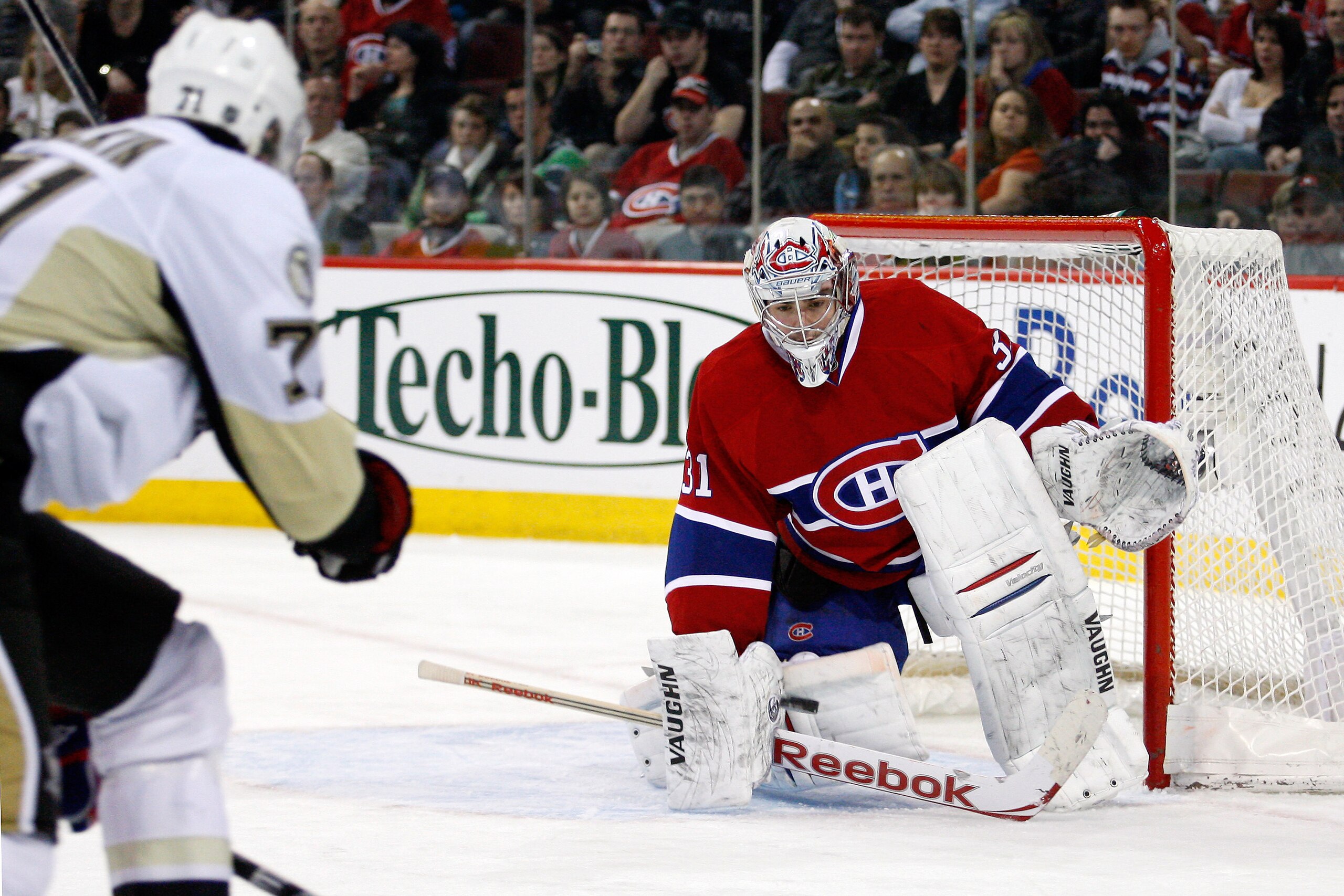 MONTREAL, CANADA - JANUARY 12: Carey Price #31 of the Montreal Canadiens gets down to stop the incoming puck on a shot by Evgeni Malkin #71 of the Pittsburgh Penguins during the NHL game at the Bell Centre on January 12, 2011 in Montreal, Quebec, Canada. MONTREAL, CANADA - JANUARY 12: Carey Price #31 of the Montreal Canadiens gets down to stop the incoming puck on a shot by Evgeni Malkin #71 of the Pittsburgh Penguins during the NHL game at the Bell Centre on January 12, 2011 in Montreal, Quebec, Canada.