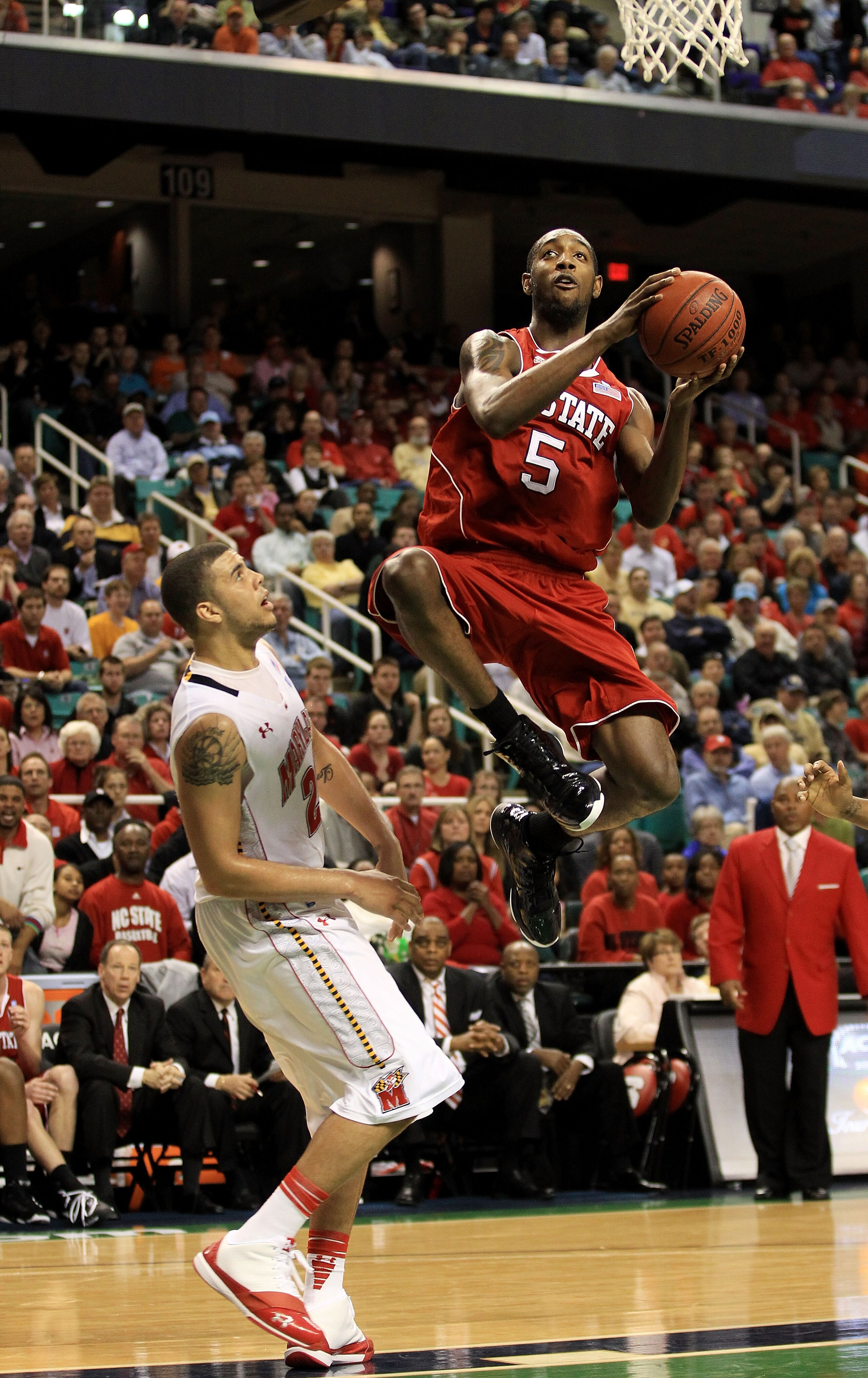 GREENSBORO, NC - MARCH 10:  C.J. Leslie #5 of the North Carolina State Wolfpack shoots against Jordan Williams #20 of the Maryland Terrapins  during the second half of the game in the first round of the 2011 ACC men's basketball tournament at the Greensbo