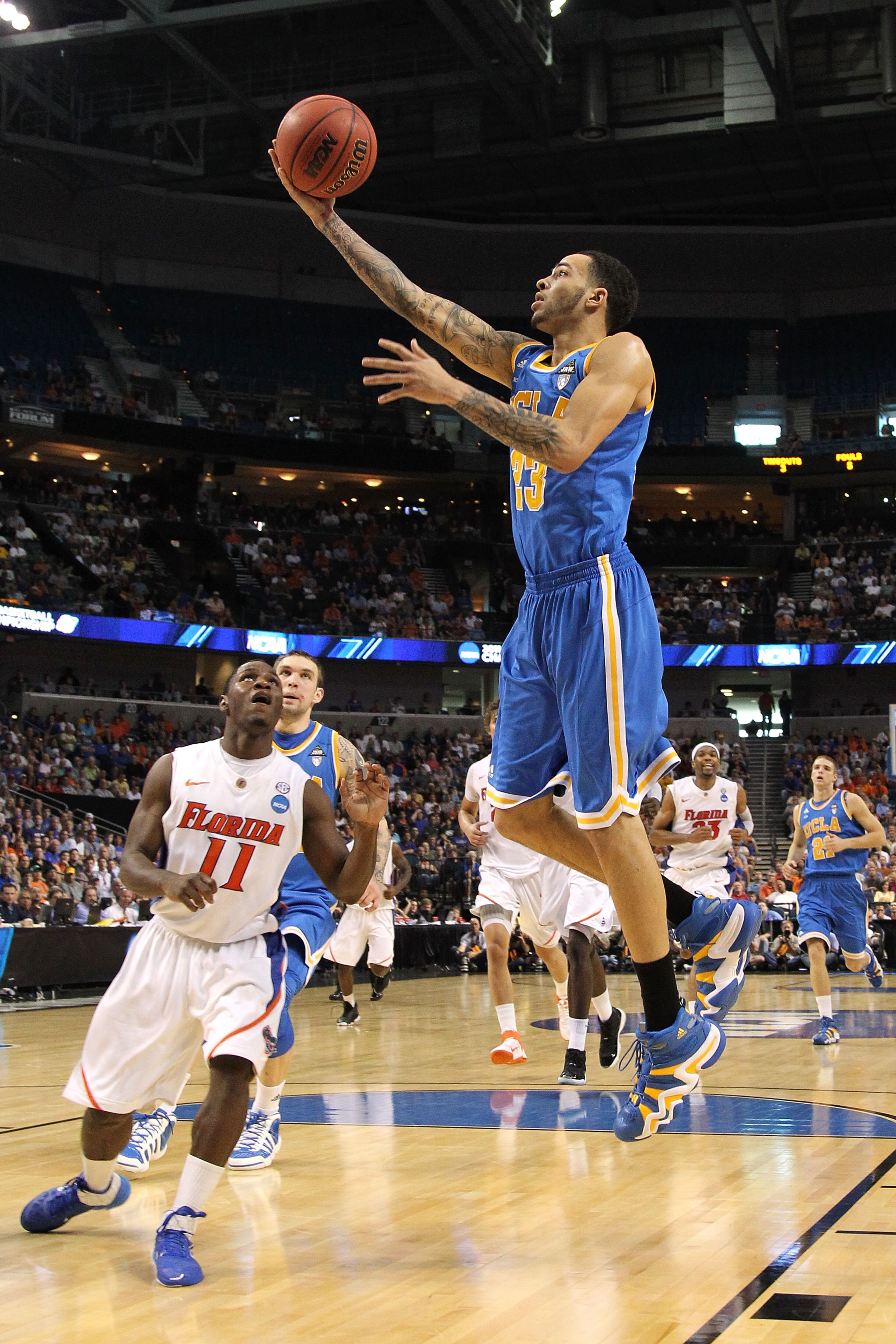 TAMPA, FL - MARCH 19: Tyler Honeycutt #23 of the UCLA Bruins drives for a shot attempt against Erving Walker #11 of the Florida Gators during the third round of the 2011 NCAA men's basketball tournament at St. Pete Times Forum on March 19, 2011 in Tampa, TAMPA, FL - MARCH 19: Tyler Honeycutt #23 of the UCLA Bruins drives for a shot attempt against Erving Walker #11 of the Florida Gators during the third round of the 2011 NCAA men's basketball tournament at St. Pete Times Forum on March 19, 2011 in Tampa,