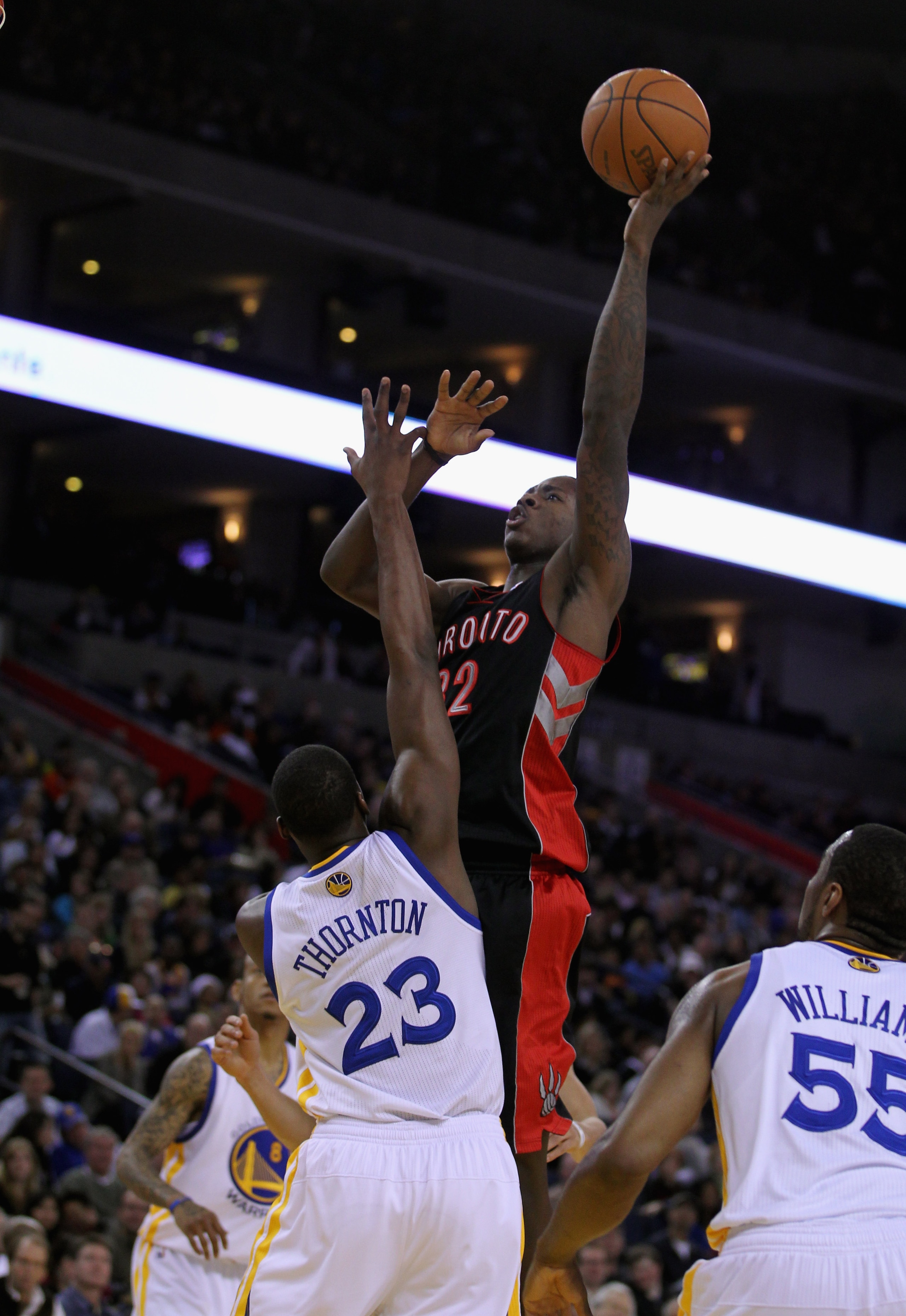 OAKLAND, CA - MARCH 25:  Ed Davis #32 of the Toronto Raptors shoots over Al Thornton #23 of the Golden State Warriors at Oracle Arena on March 25, 2011 in Oakland, California. NOTE TO USER: User expressly acknowledges and agrees that, by downloading and o