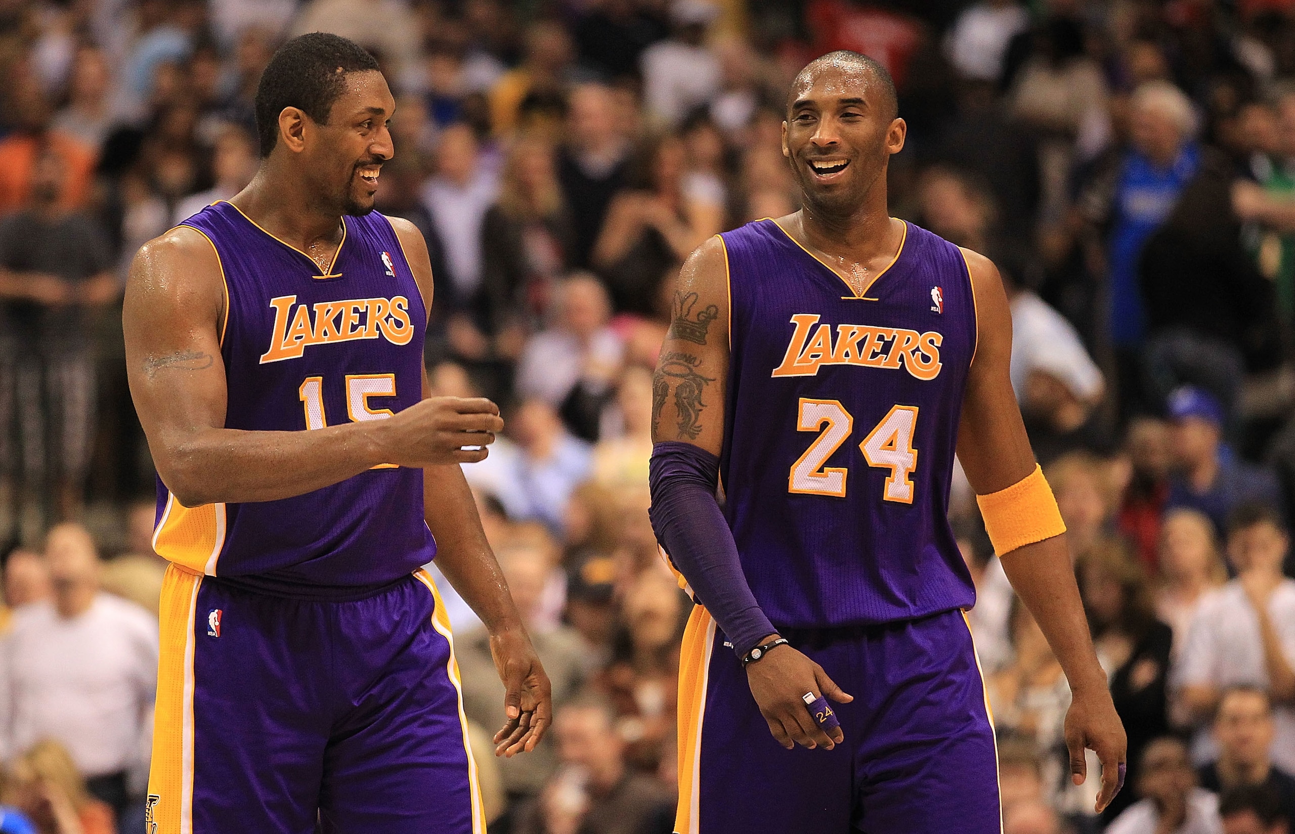 DALLAS, TX - MARCH 12:  Kobe Bryant #24 and Ron Artest #15 of the Los Angeles Lakers react after a 96-91 win against the Dallas Mavericks at American Airlines Center on March 12, 2011 in Dallas, Texas.  NOTE TO USER: User expressly acknowledges and agrees