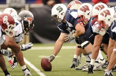 Fusco (center) in the 2011 Senior Bowl, surrounded by FBS players.