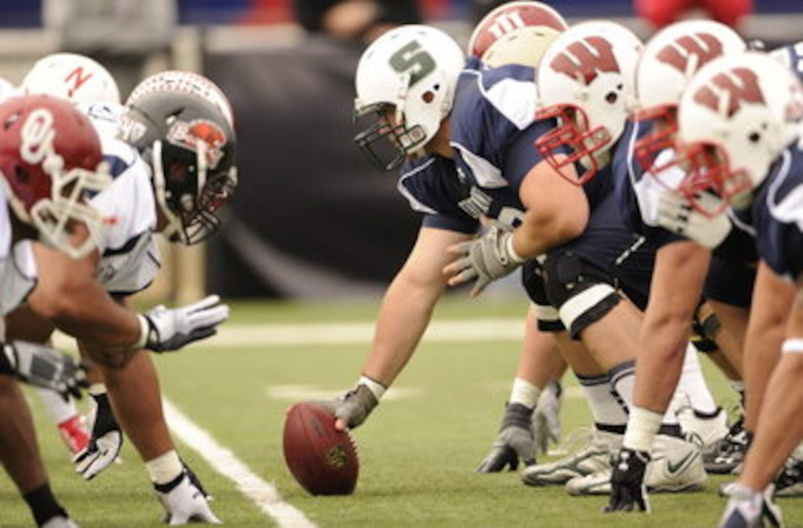 Fusco (center) in the 2011 Senior Bowl, surrounded by FBS players.