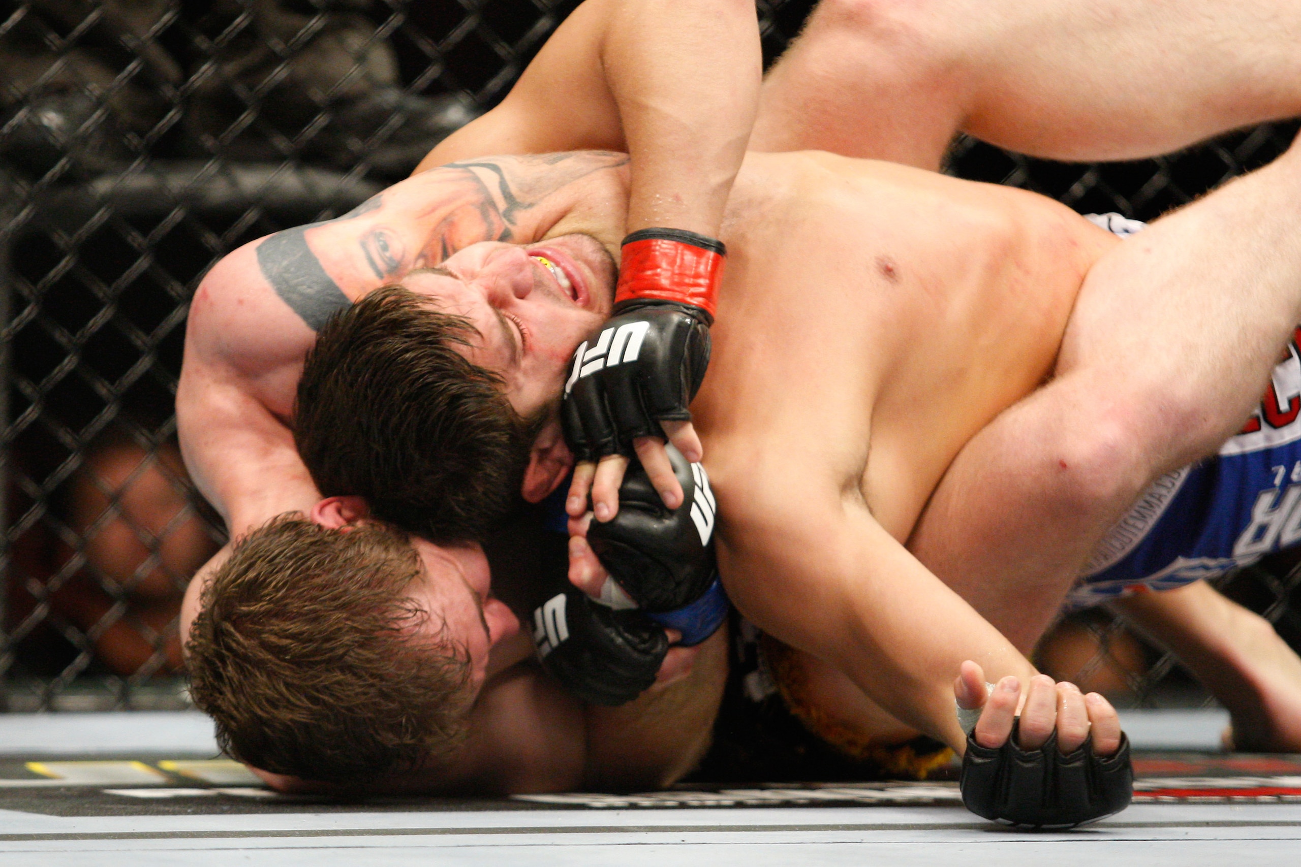 MONTREAL- MAY 8: Alan Belcher (bottom) holds on to Patrick Cote in their middleweight bout at UFC 113 at Bell Centre on May 8, 2010 in Montreal, Quebec, Canada. Alan Belcher won the bout by KO. (Photo by Richard Wolowicz/Getty Images)