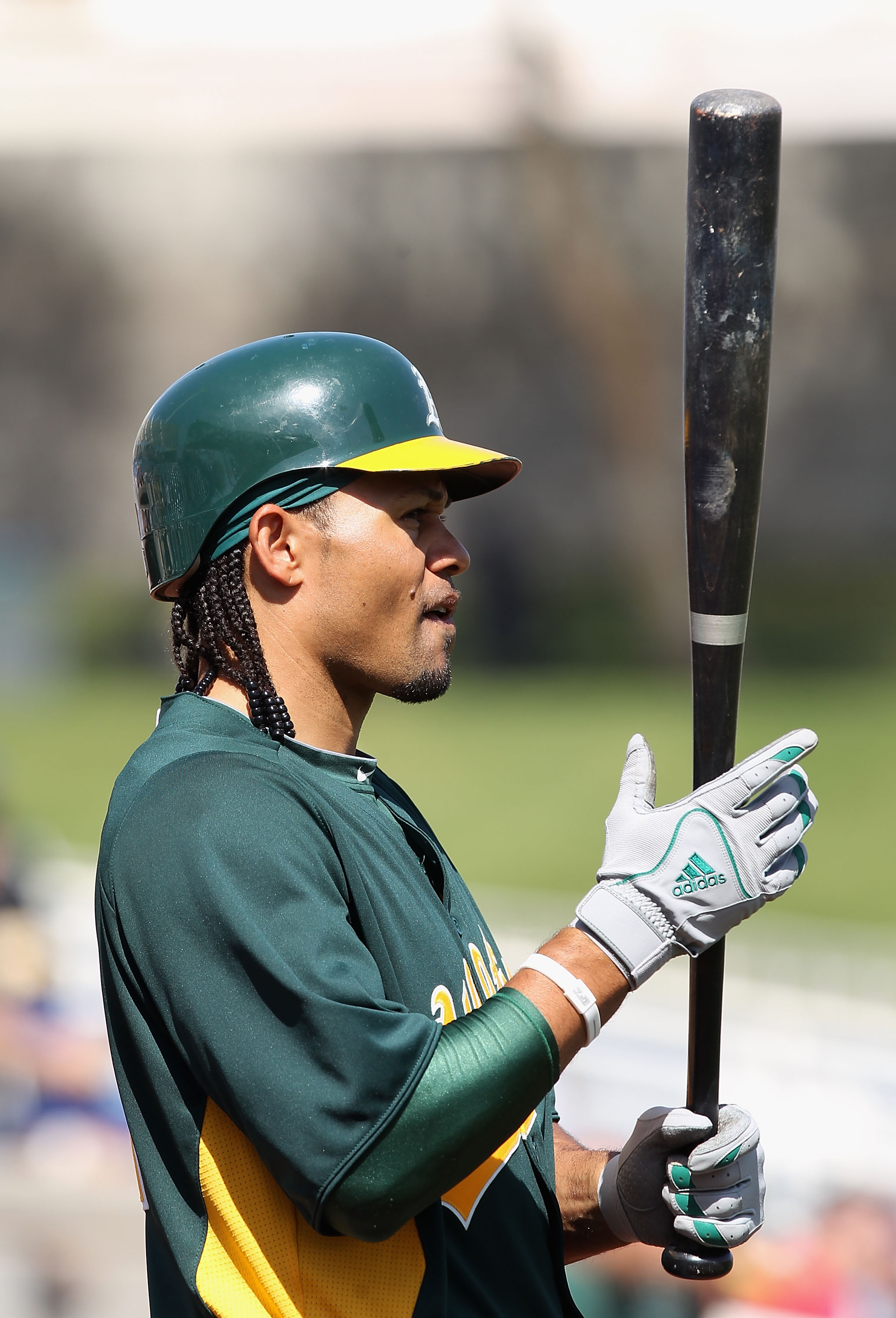 PHOENIX, AZ - MARCH 03:  Coco Crisp #4 of the Oakland Athletics prepares to bat during the spring training game against the Milwaukee Brewers at Maryvale Baseball Park on March 3, 2011 in Phoenix, Arizona.  (Photo by Christian Petersen/Getty Images)
