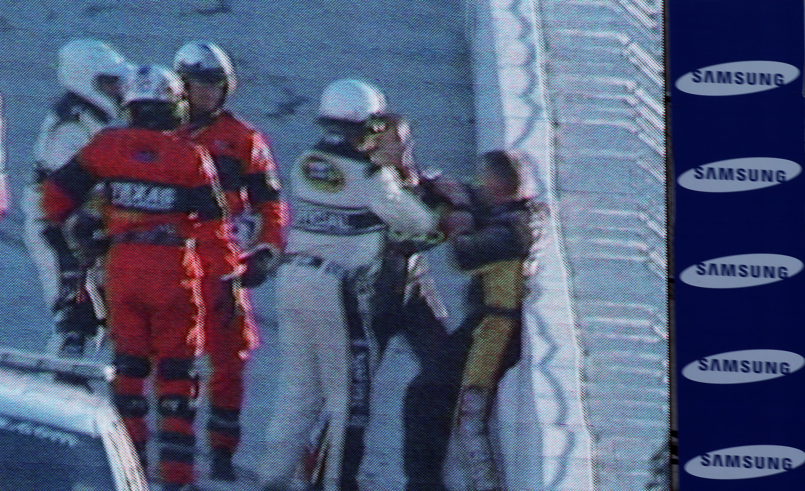 FORT WORTH, TX - NOVEMBER 07:  NASCAR officials break up a fight between Jeff Gordon (2R), driver of the #24 DuPont/National Guard Chevrolet, and Jeff Burton (R), driver of the #31 Caterpillar Chevrolett, as seen on the Sprint Vision screen in the infield