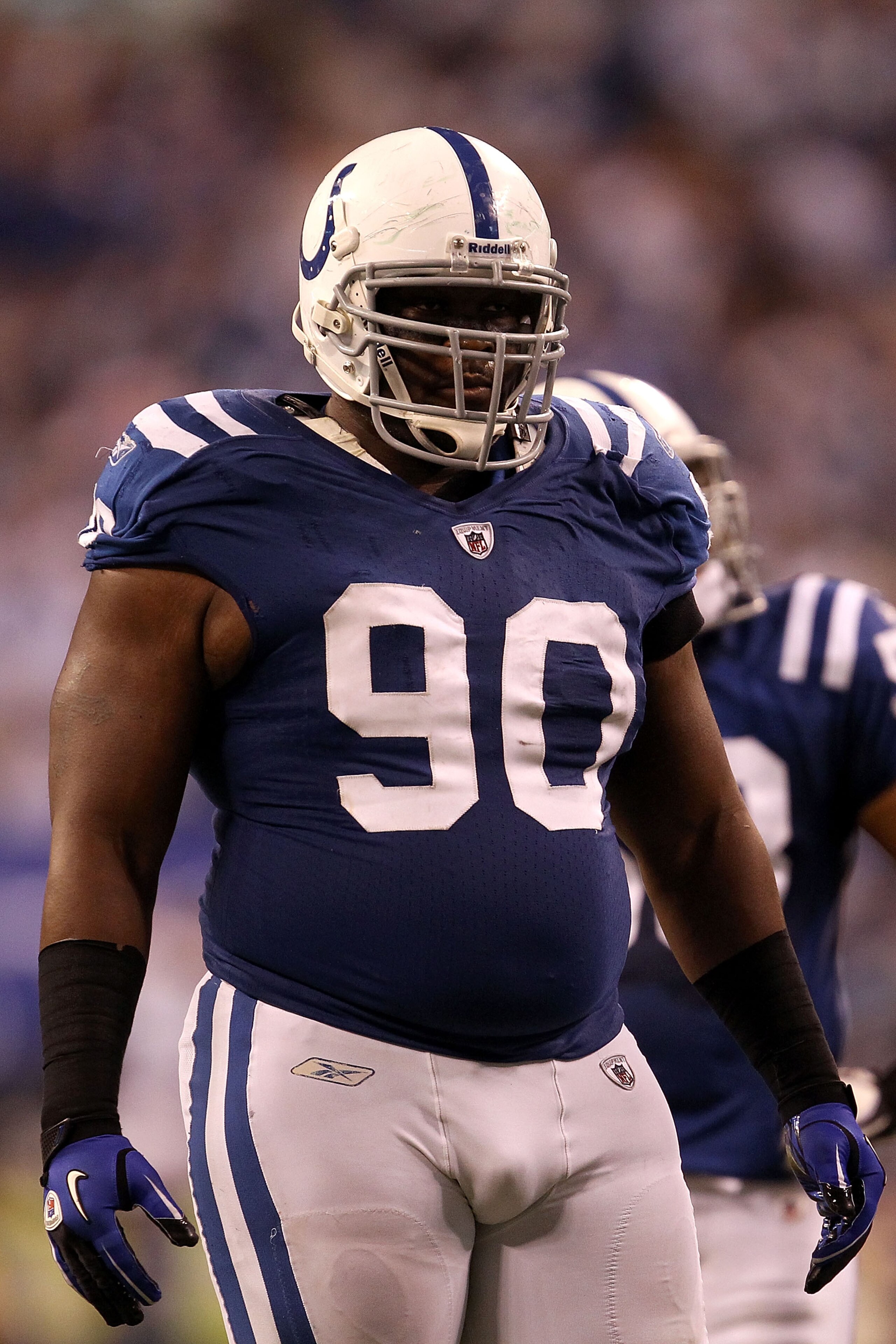 INDIANAPOLIS, IN - JANUARY 08:  Dan Muir #90 of the Indianapolis Colts looks on against the New York Jets during their 2011 AFC wild card playoff game at Lucas Oil Stadium on January 8, 2011 in Indianapolis, Indiana. The Jets won 17-16.  (Photo by Jonatha