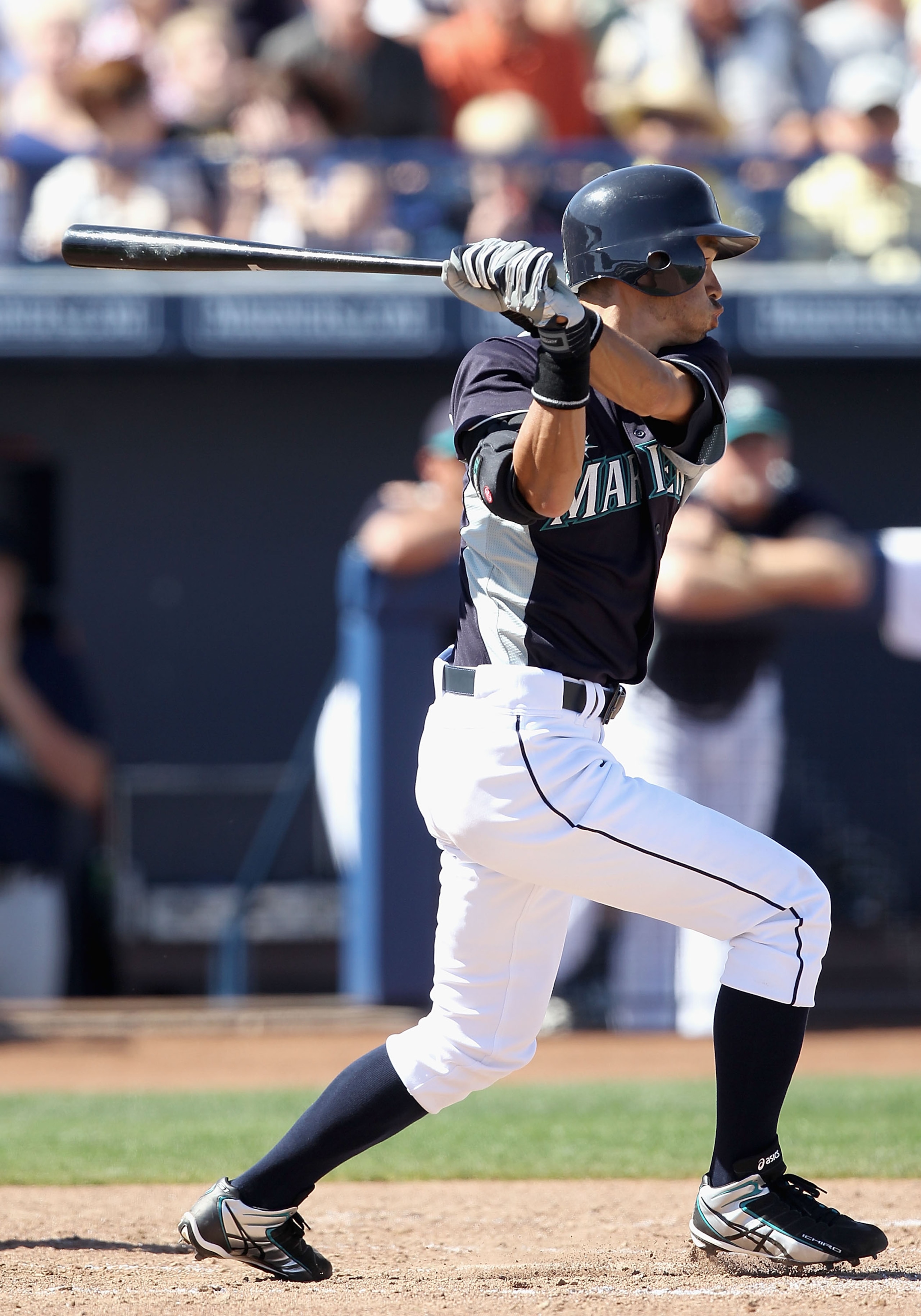 PEORIA, AZ - MARCH 12:  Ichiro Suzuki #51 of the Seattle Mariners hits a single against the Oakland Athletics during the second inning of the spring training game at Peoria Stadium on March 12, 2011 in Peoria, Arizona.  (Photo by Christian Petersen/Getty 