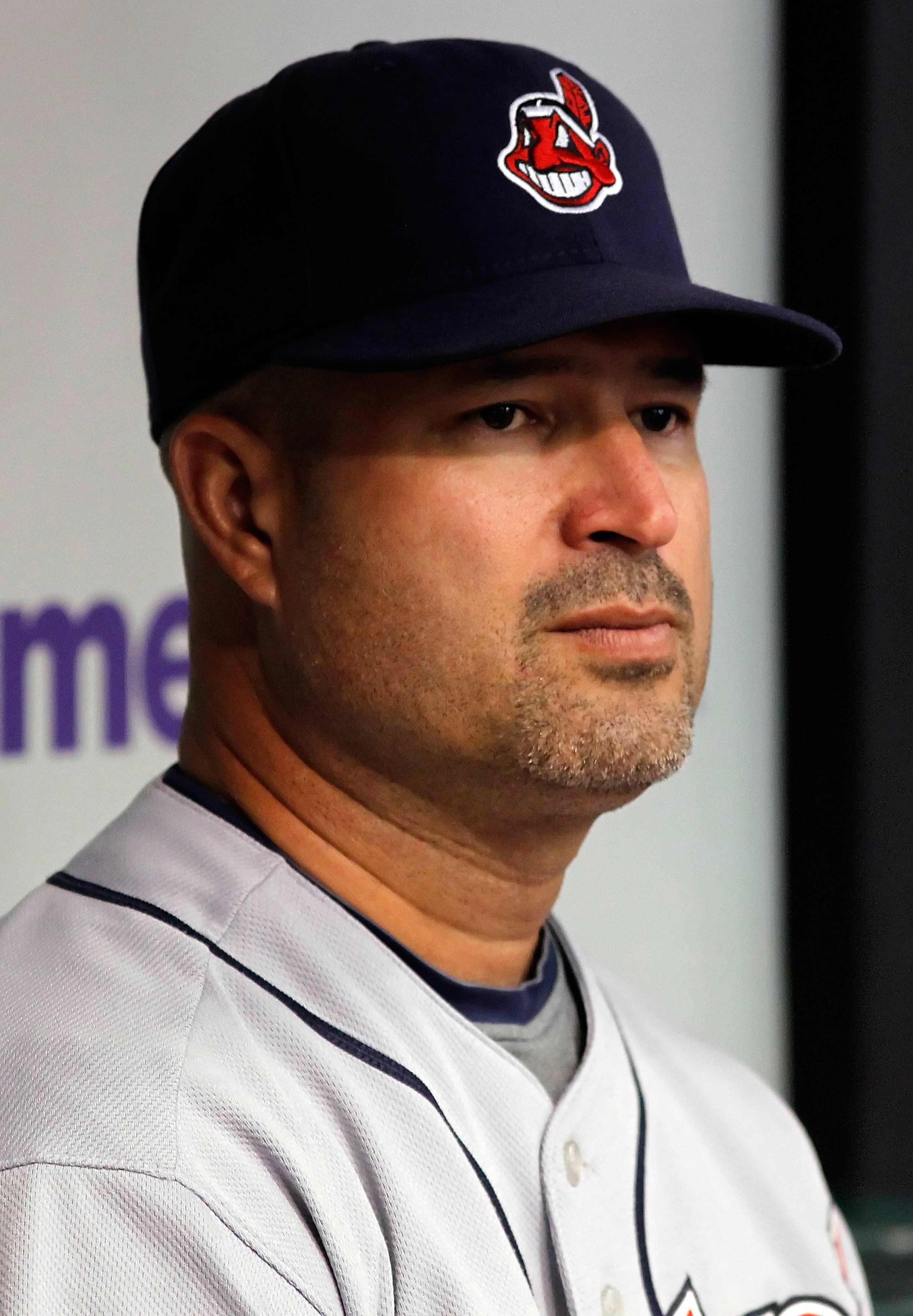 ST. PETERSBURG - JULY 11:  Manager Manny Acta #11 of the Cleveland Indians watches his team from the dugout against the Tampa Bay Rays at Tropicana Field on July 11, 2010 in St. Petersburg, Florida.  (Photo by J. Meric/Getty Images)