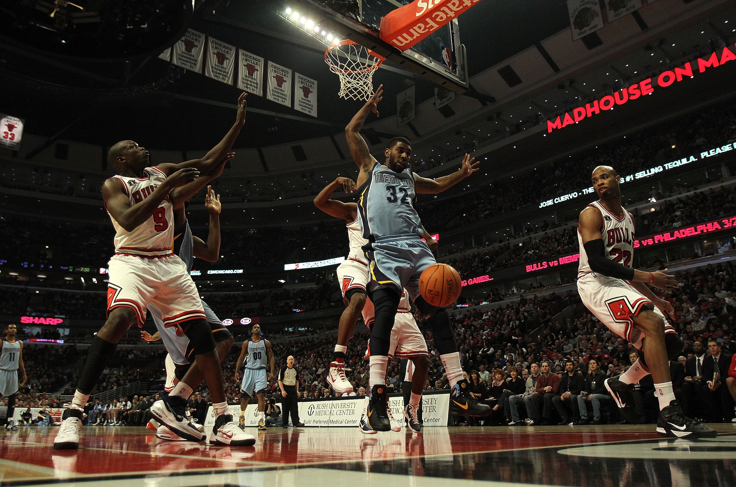 CHICAGO, IL - MARCH 25: O.J. Mayo #32 of the Memphis Grizzlies looses control of the ball under pressure from Kurt Thomas #40 of the Chicago Bulls as Loul Deng #9 (L) and Taj Gibson #22 defend at the United Center on March 25, 2011 in Chicago, Illinois. T