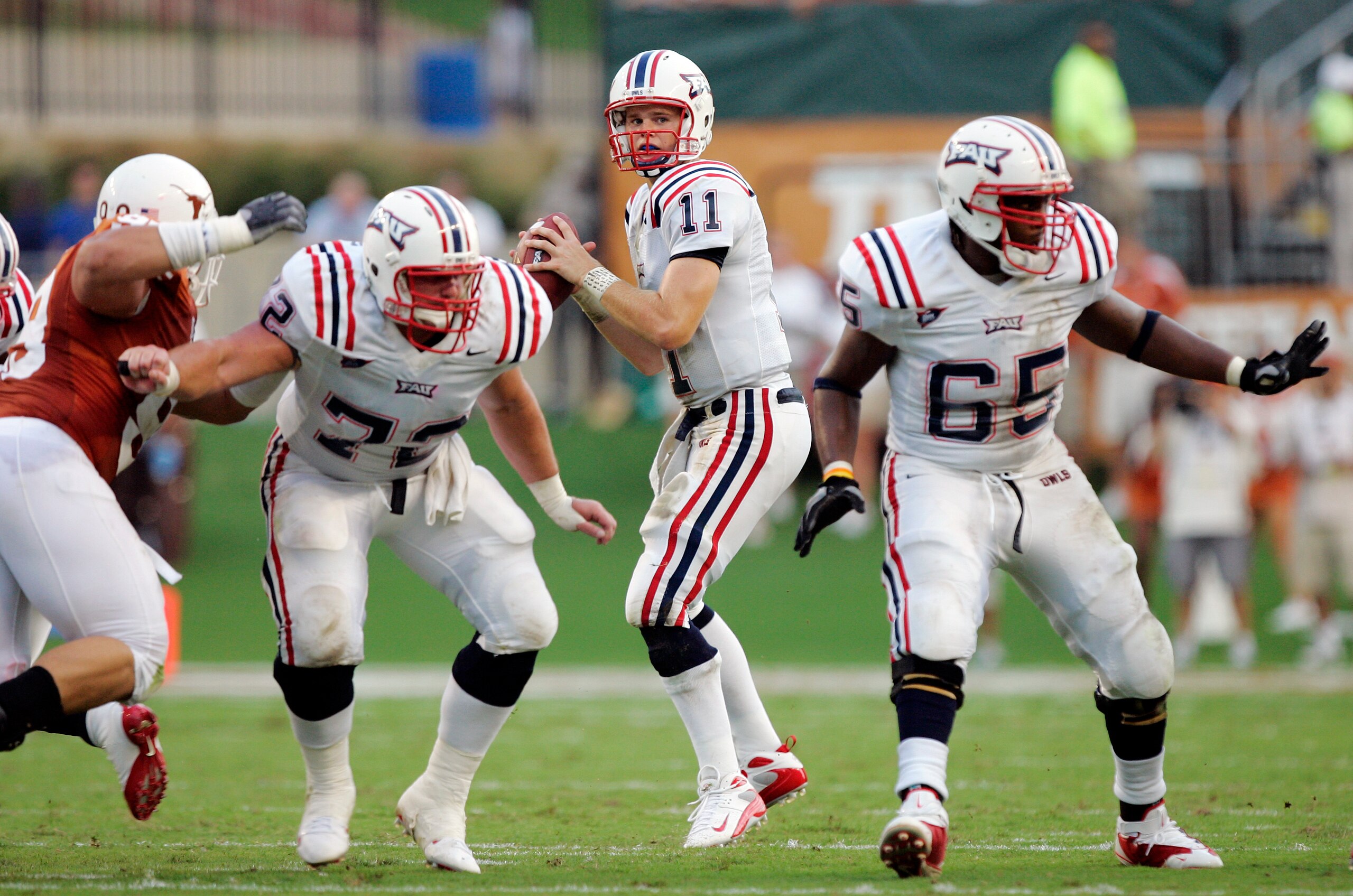 AUSTIN, TX - AUGUST 30: Quarterback Rusty Smith #11 of the Florida Atlantic Owls looks to throw as lineman David Matlock #72 and Brandon Jackson #65 block against the Texas Longhorns in the second quarter at Darrell K Royal-Texas Memorial Stadium on Augu AUSTIN, TX - AUGUST 30: Quarterback Rusty Smith #11 of the Florida Atlantic Owls looks to throw as lineman David Matlock #72 and Brandon Jackson #65 block against the Texas Longhorns in the second quarter at Darrell K Royal-Texas Memorial Stadium on Augu