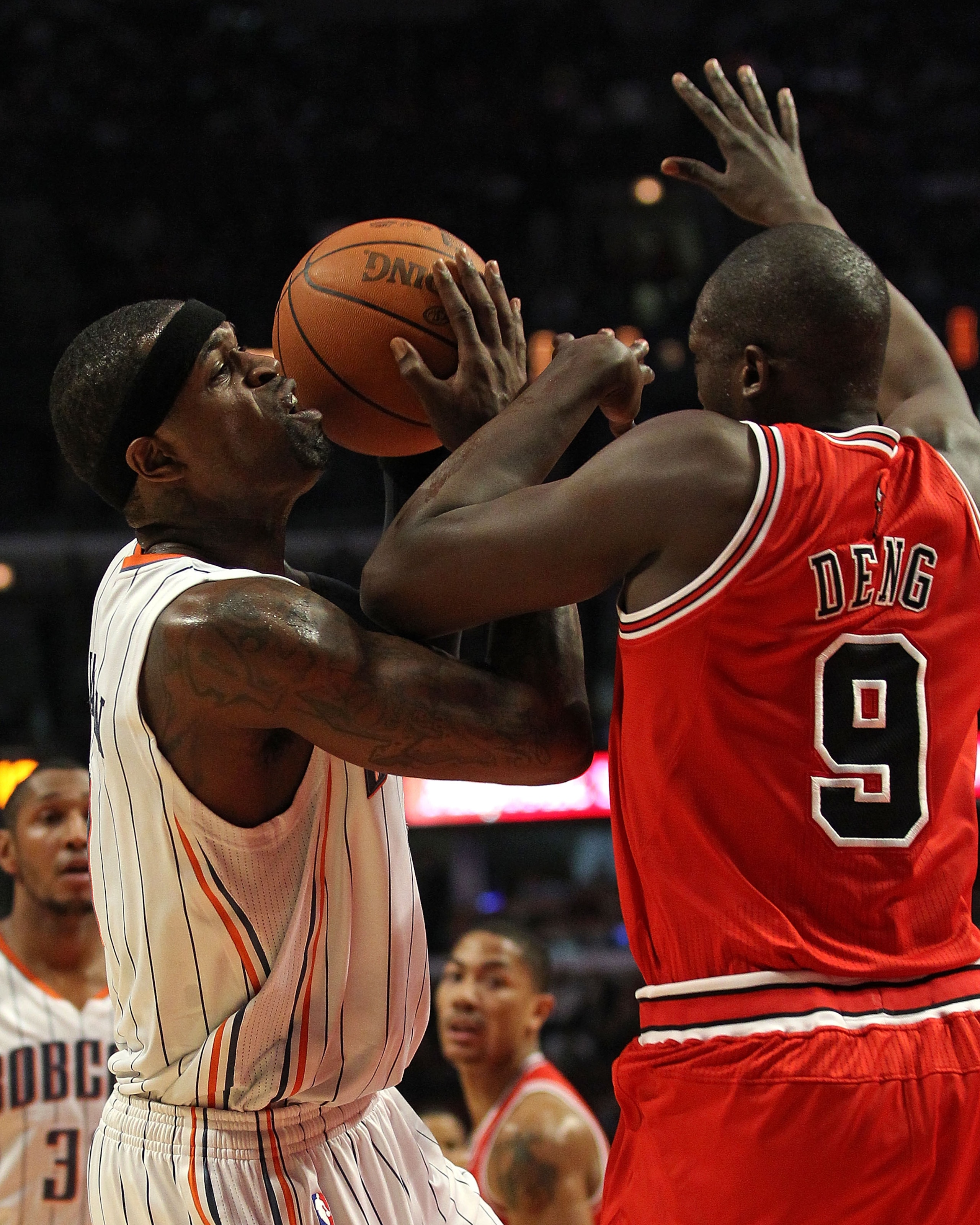 CHICAGO, IL - FEBRUARY 15: Stephen Jackson #1 of the Charlotte Bobcats is fouled by Loul Deng #9 of the Chicago Bulls at the United Center on February 15, 2011 in Chicago, Illinois. NOTE TO USER: User expressly acknowledges and agrees that, by downloading